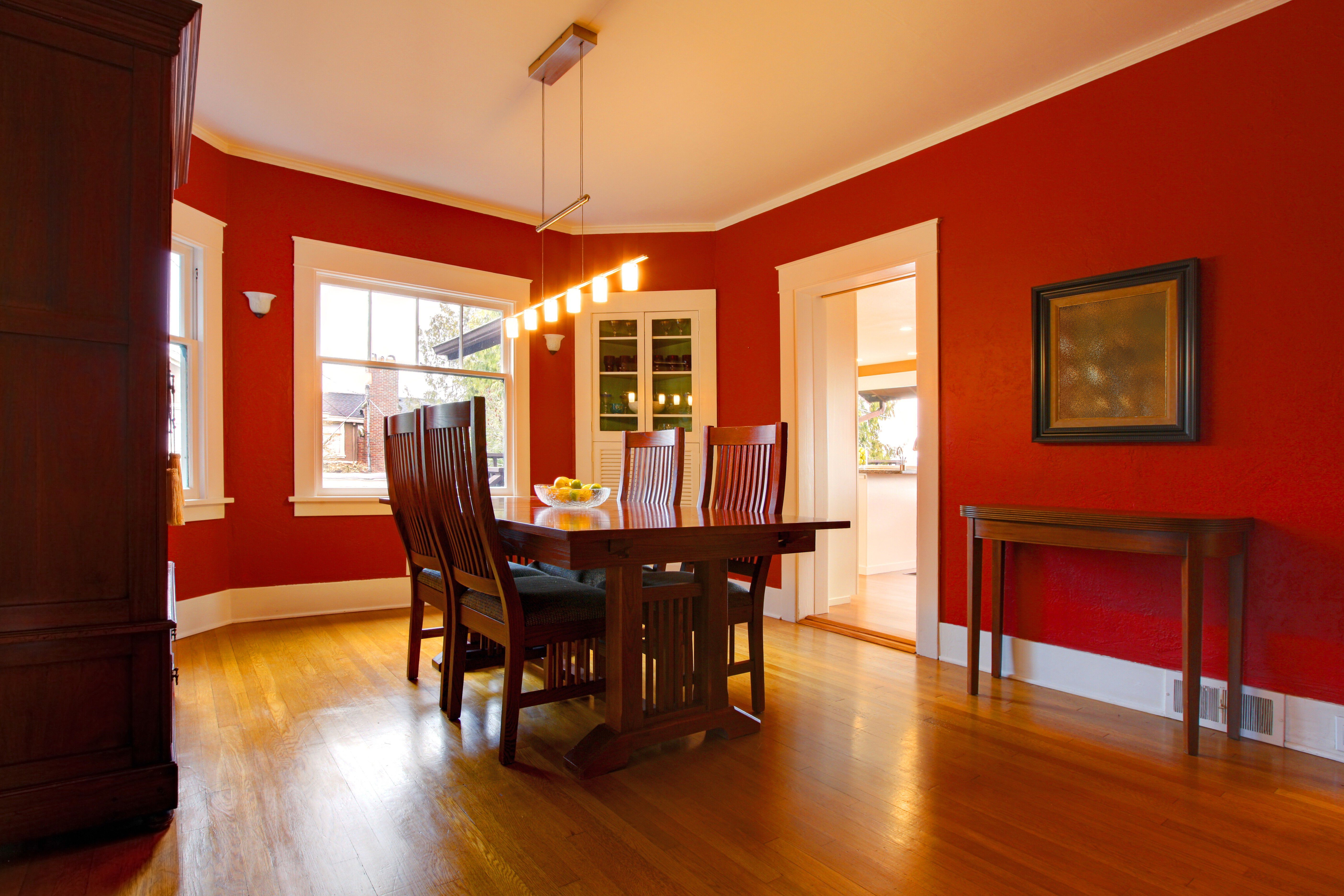 Red dining room with mission style dining set