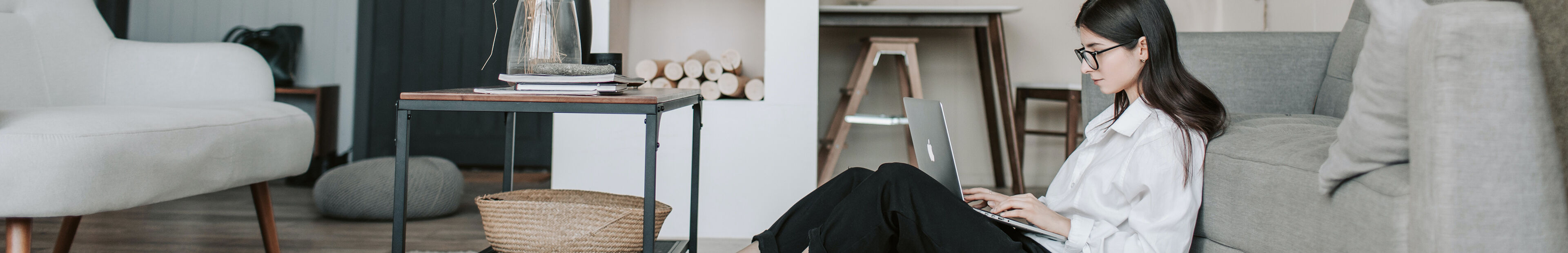 woman on laptop in her living room
