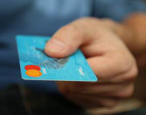 man holding debit card