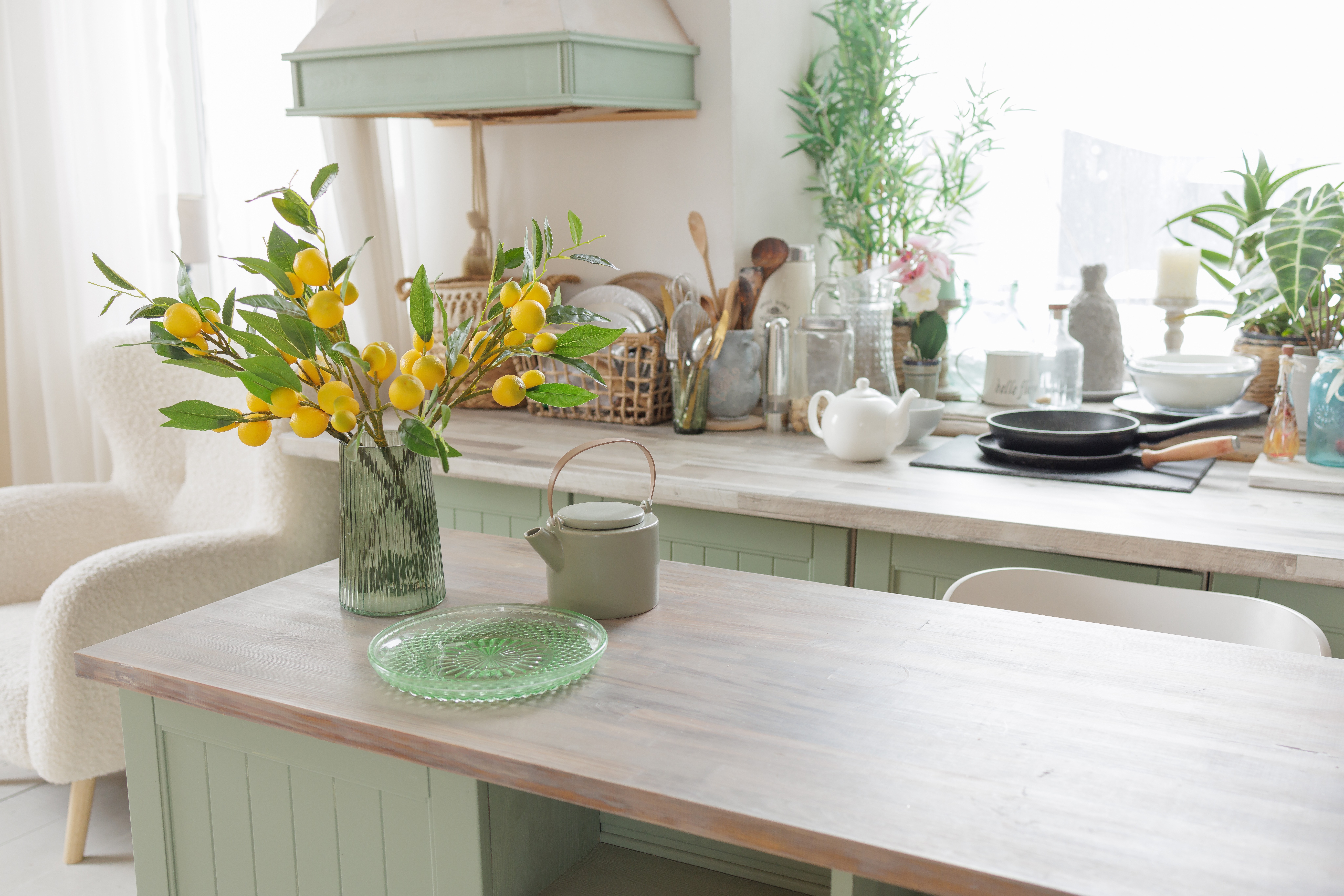 Seafoam green cabinets give a coastal feel to a kitchen