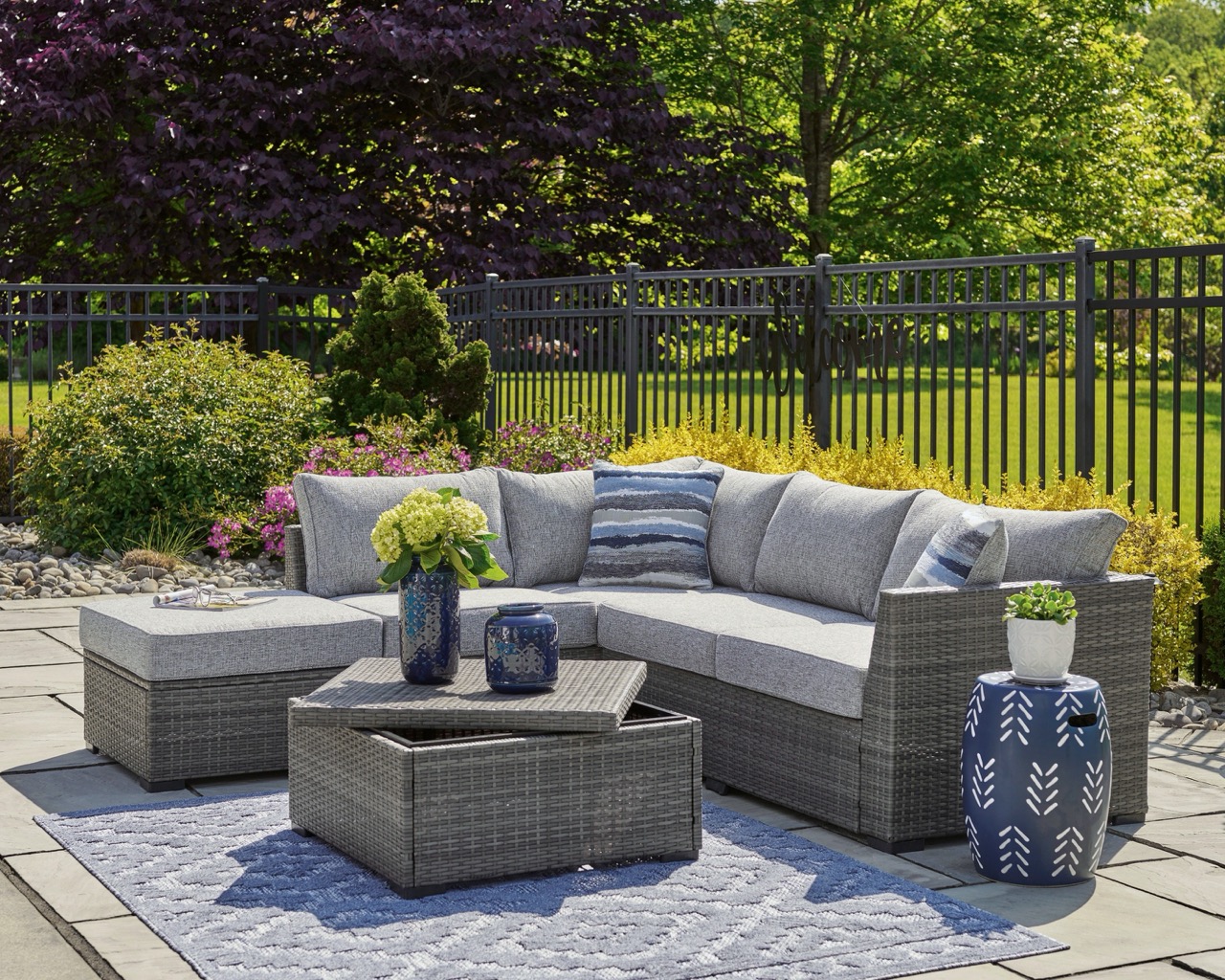 gray outdoor sectional with a storage coffee table
