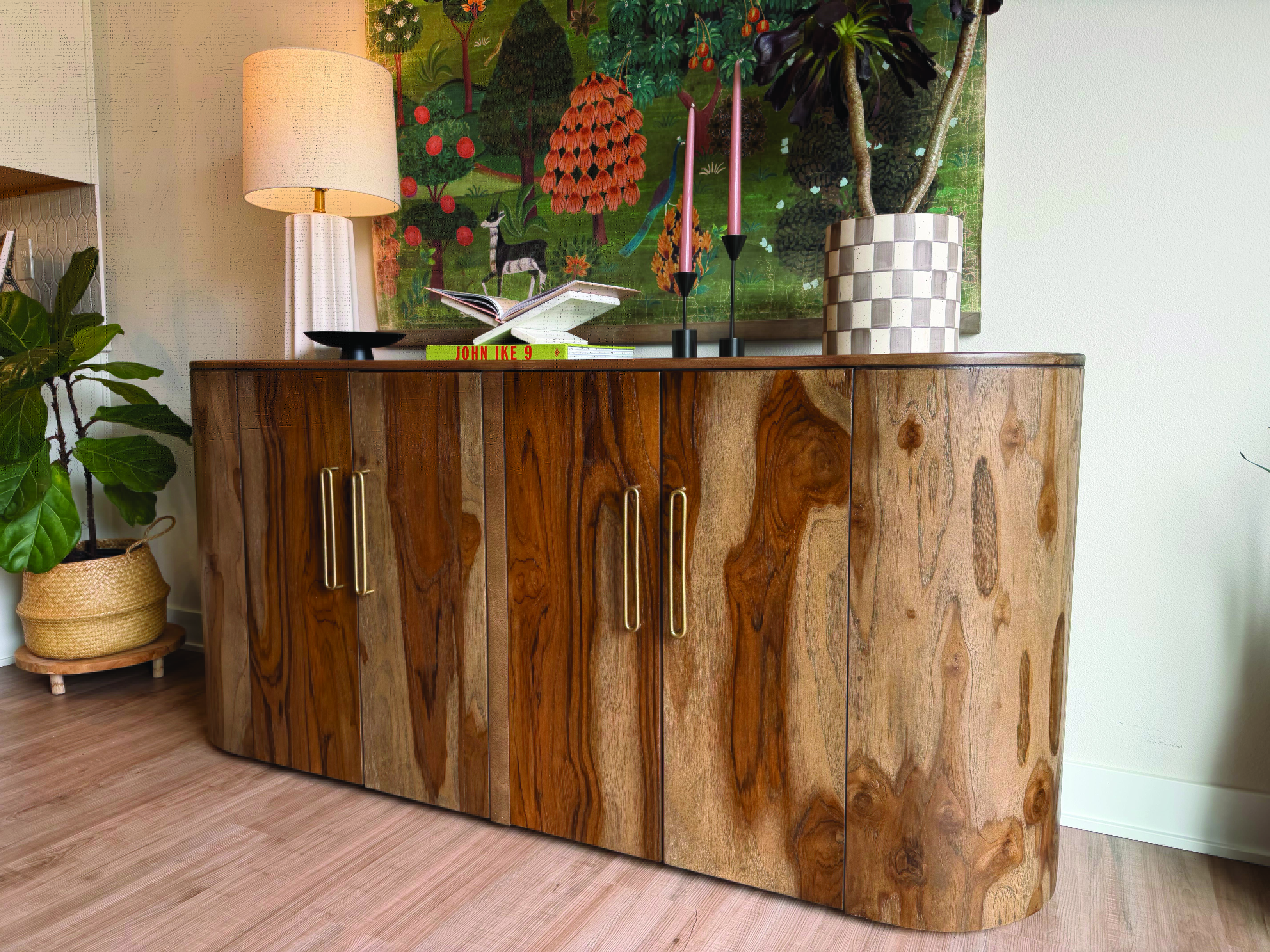 natural wood cabinet with accessories and art pieces surrounding it