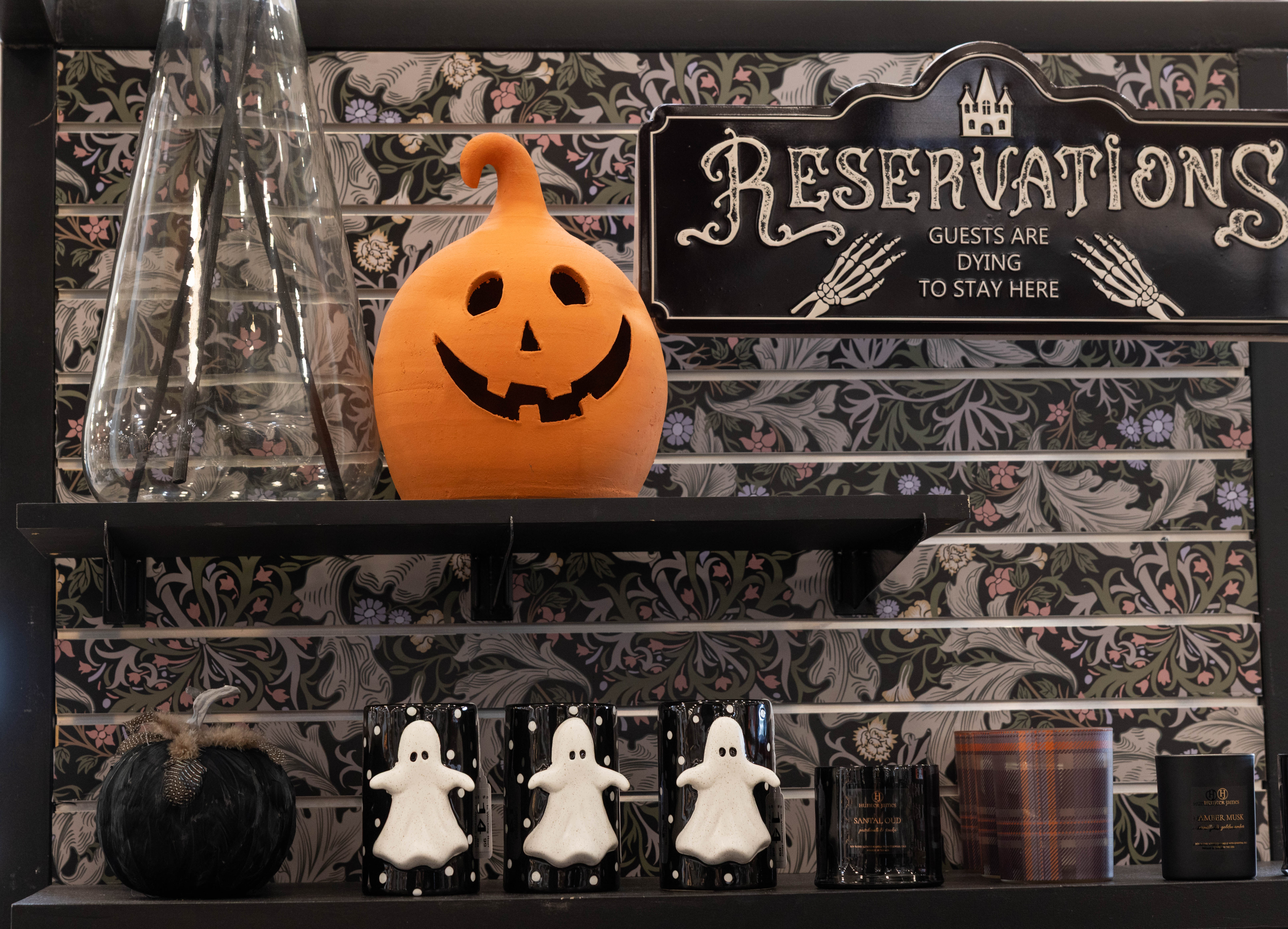 pumkins and ghost displayed on store shelves