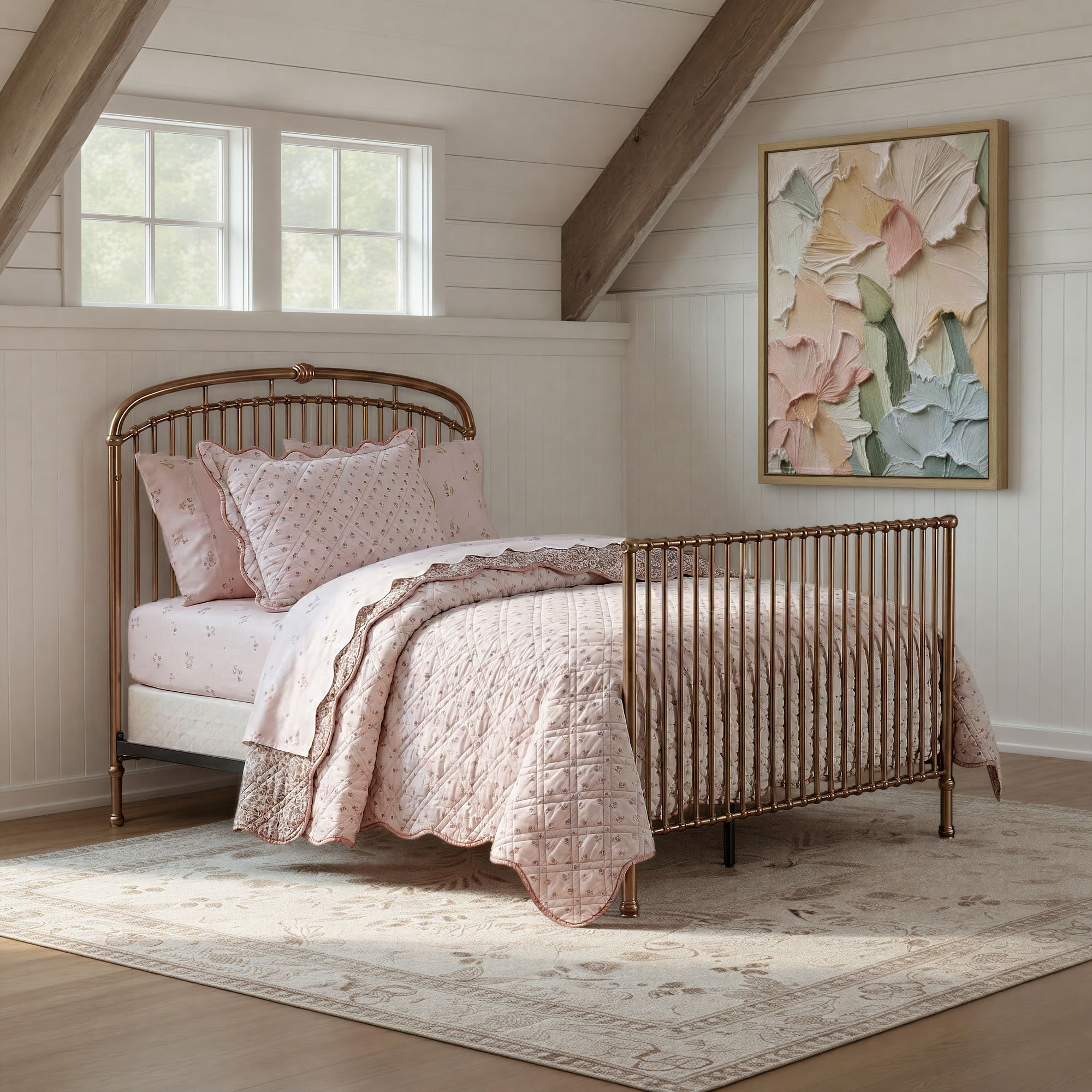 Olivia brass crib with pink bedding and abstract artwork on the wall
