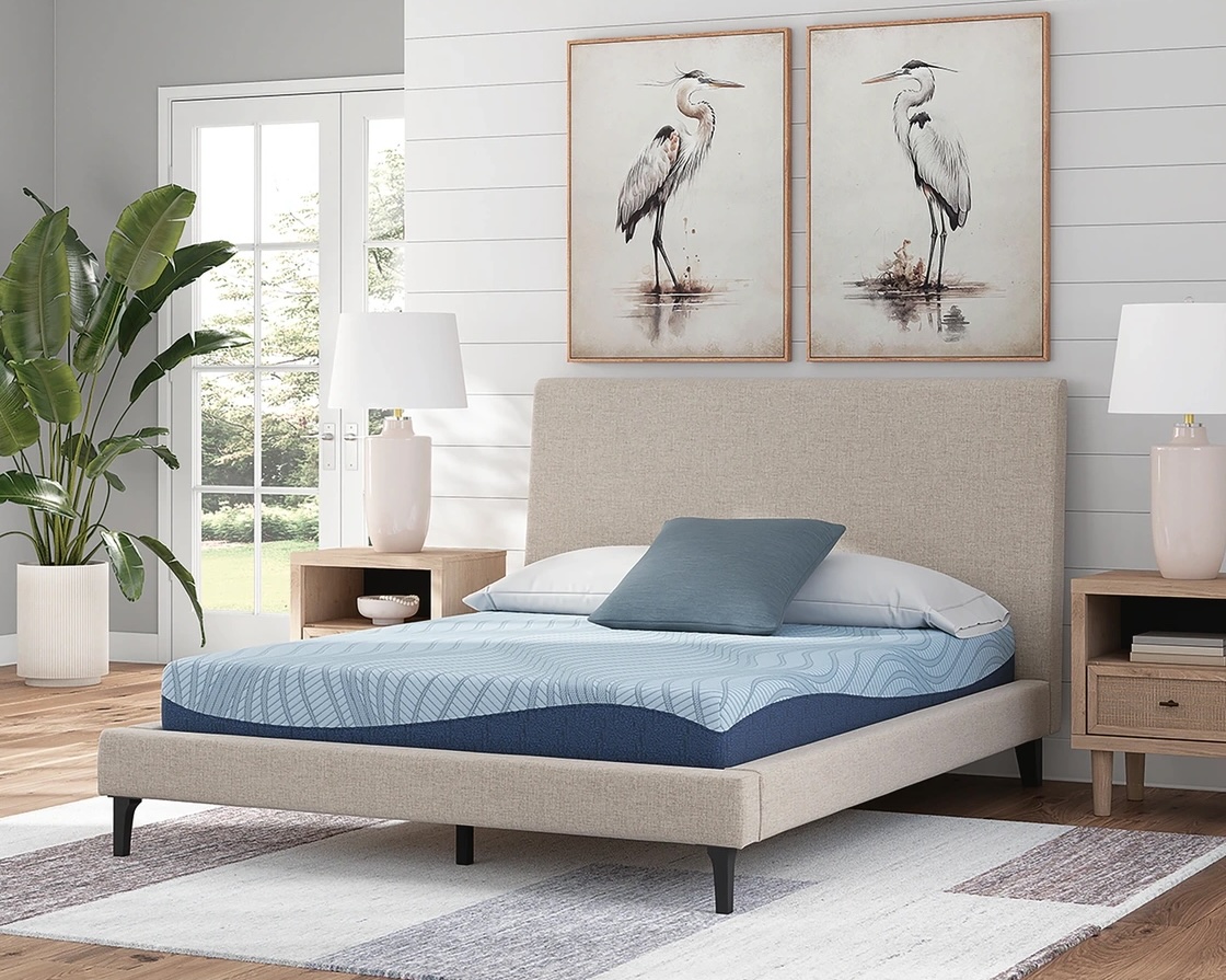 mattress on bed in bedroom