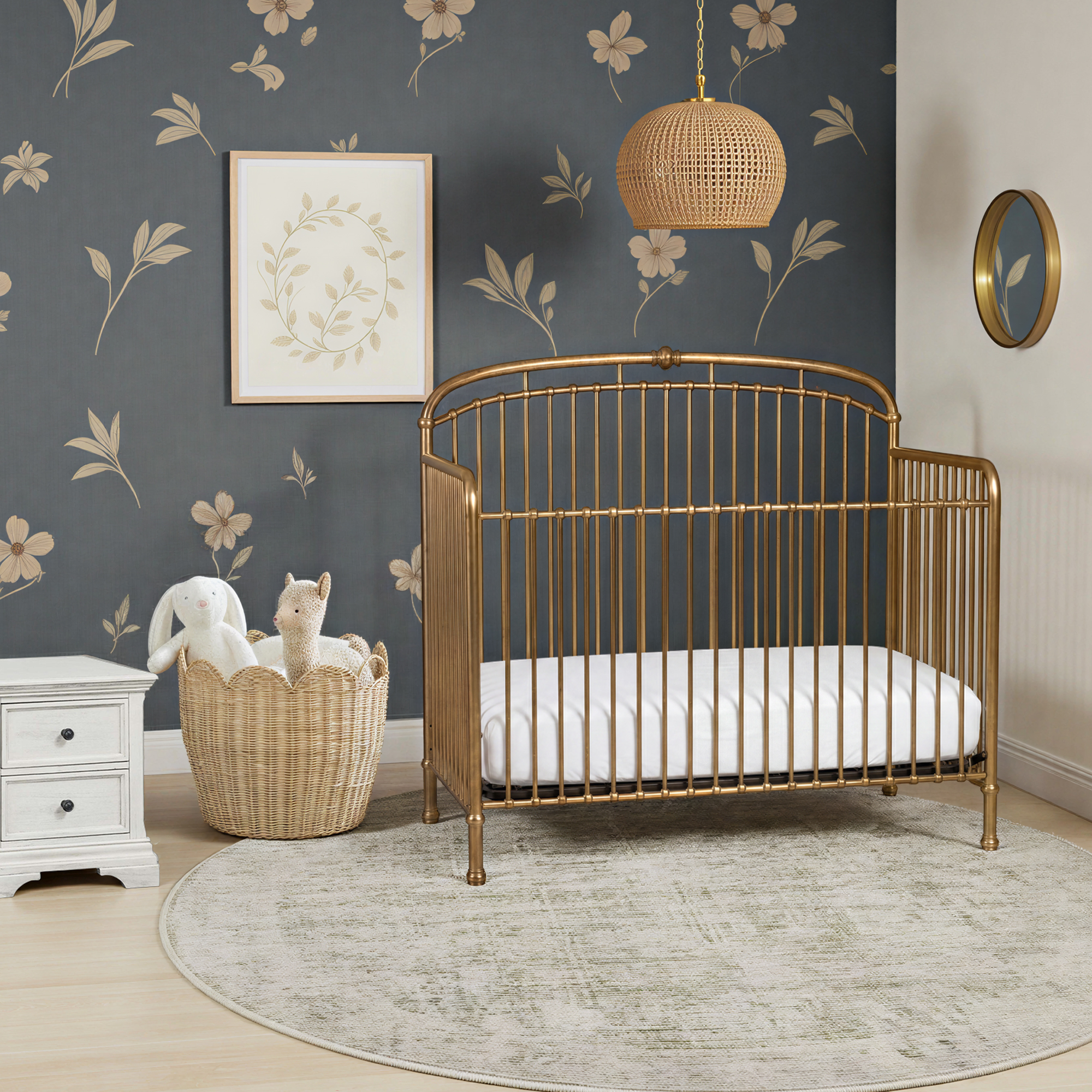 Olivia brass crib in a gender neutral nursery with blue floral wall paper