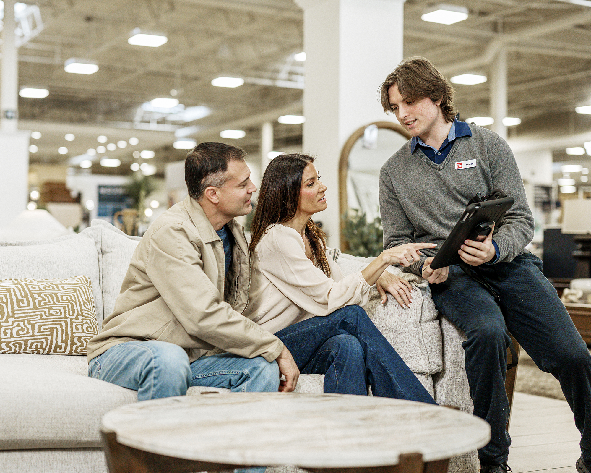 two people purchasing furniture in showroom
