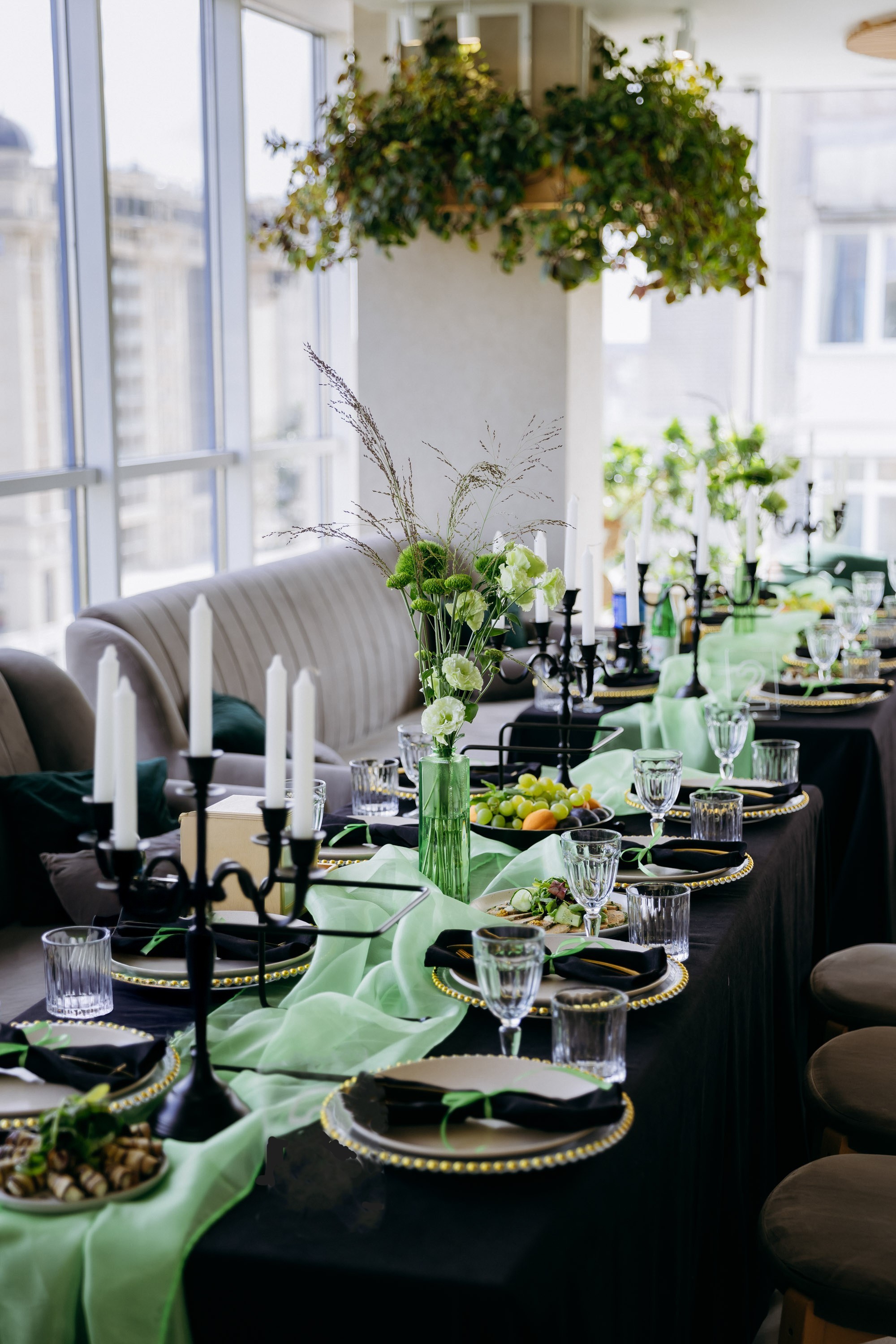 A formal St. Patrick's Day table set for dining with green toile and glassware