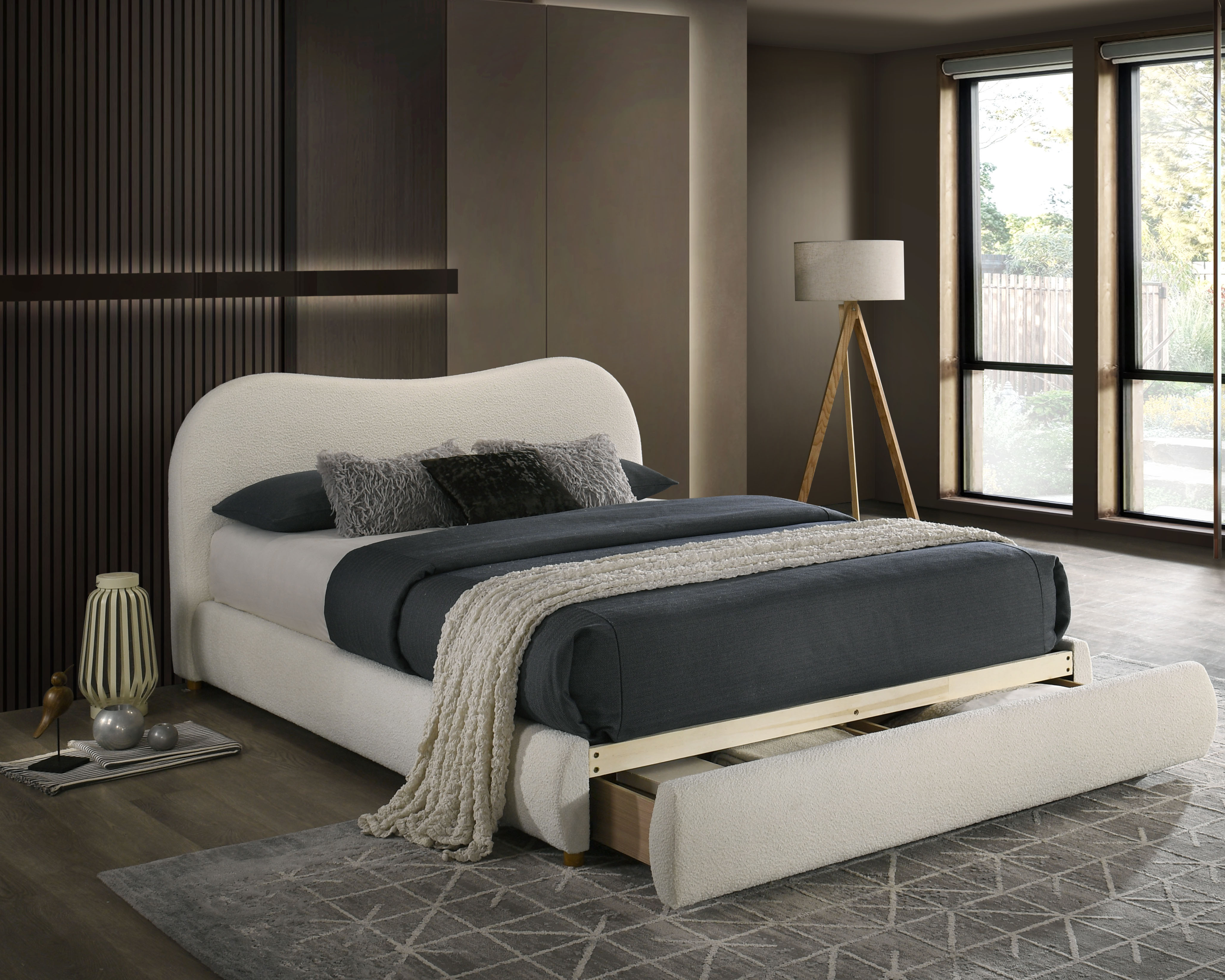 Ivory toned upholstered bed with pull out drawer storage at base