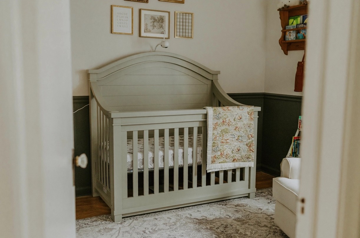 Classic nursery with sage green crib