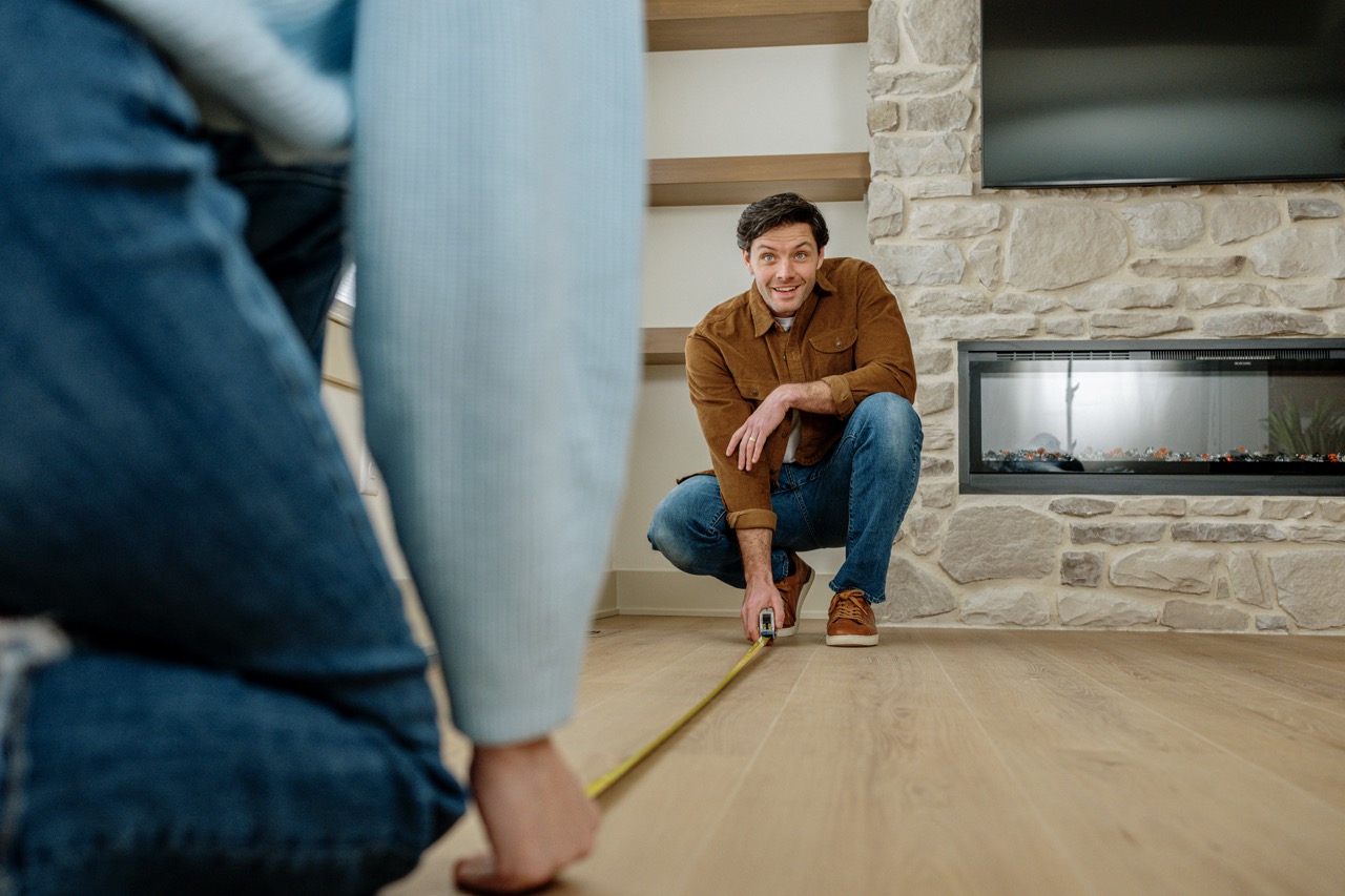 measuring the room to ensure furniture fits smoothly