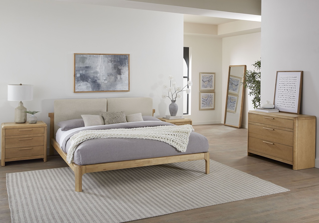 bedroom featuring bed, nightstand, dresser, and rug