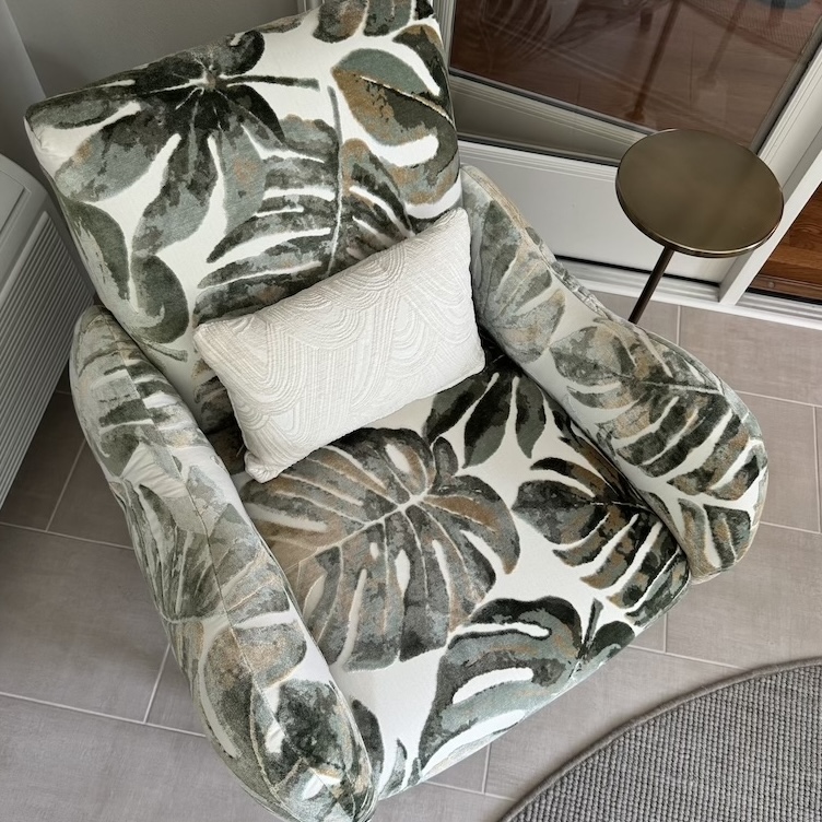 accent chair featuring large monstera leaves