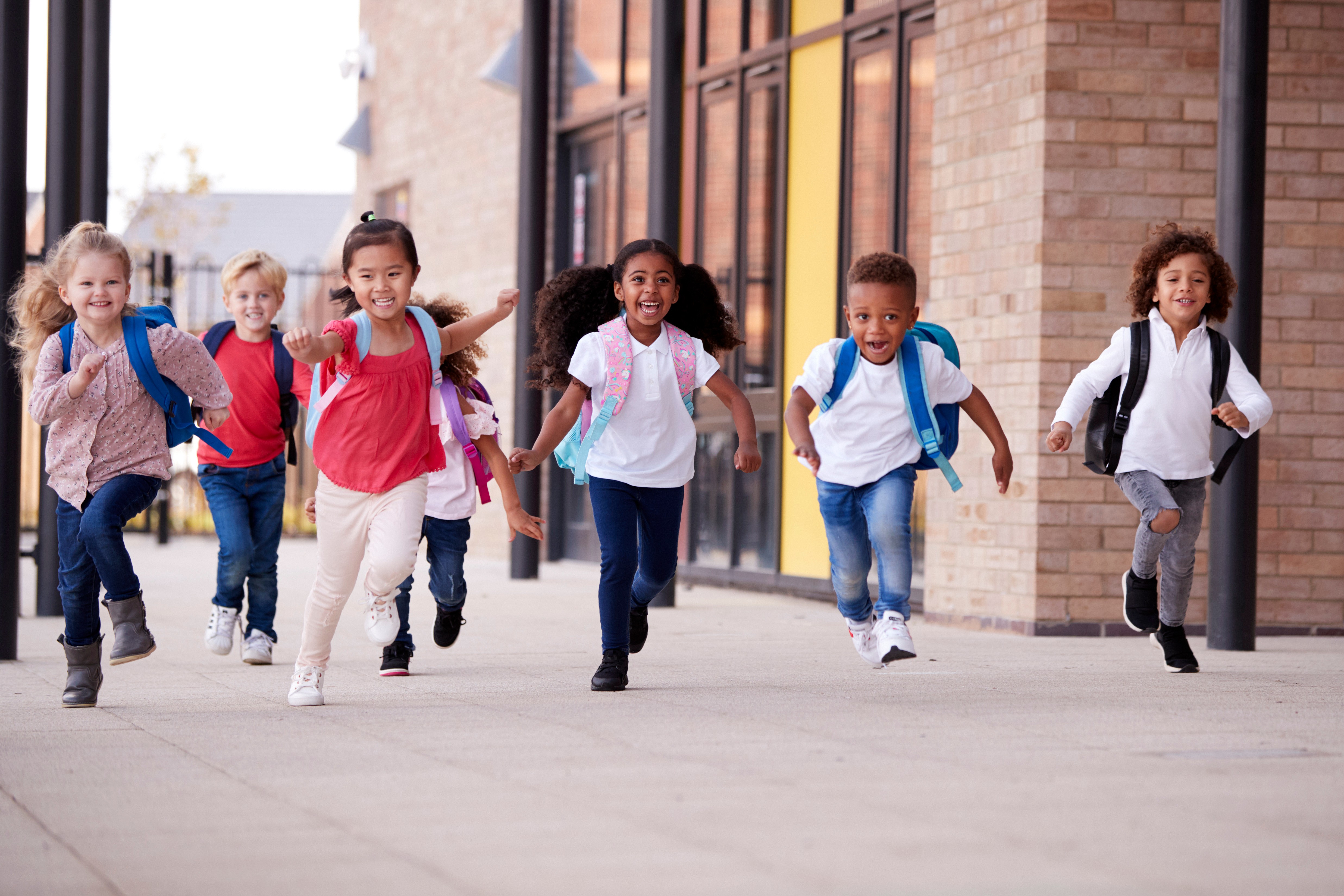 Kids running out of school after last bell ring of the year