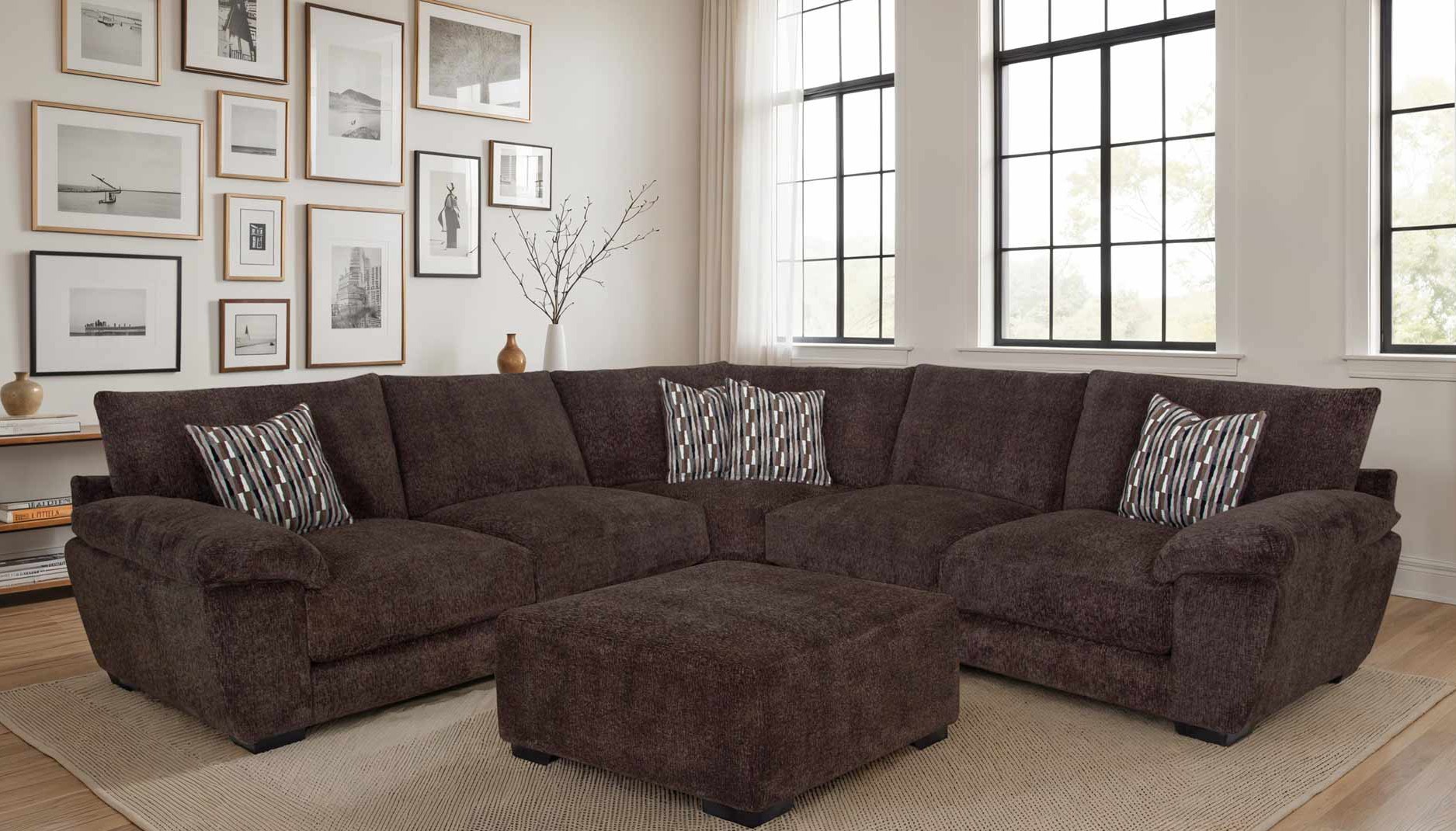 Mixed wall art above sectional in living room