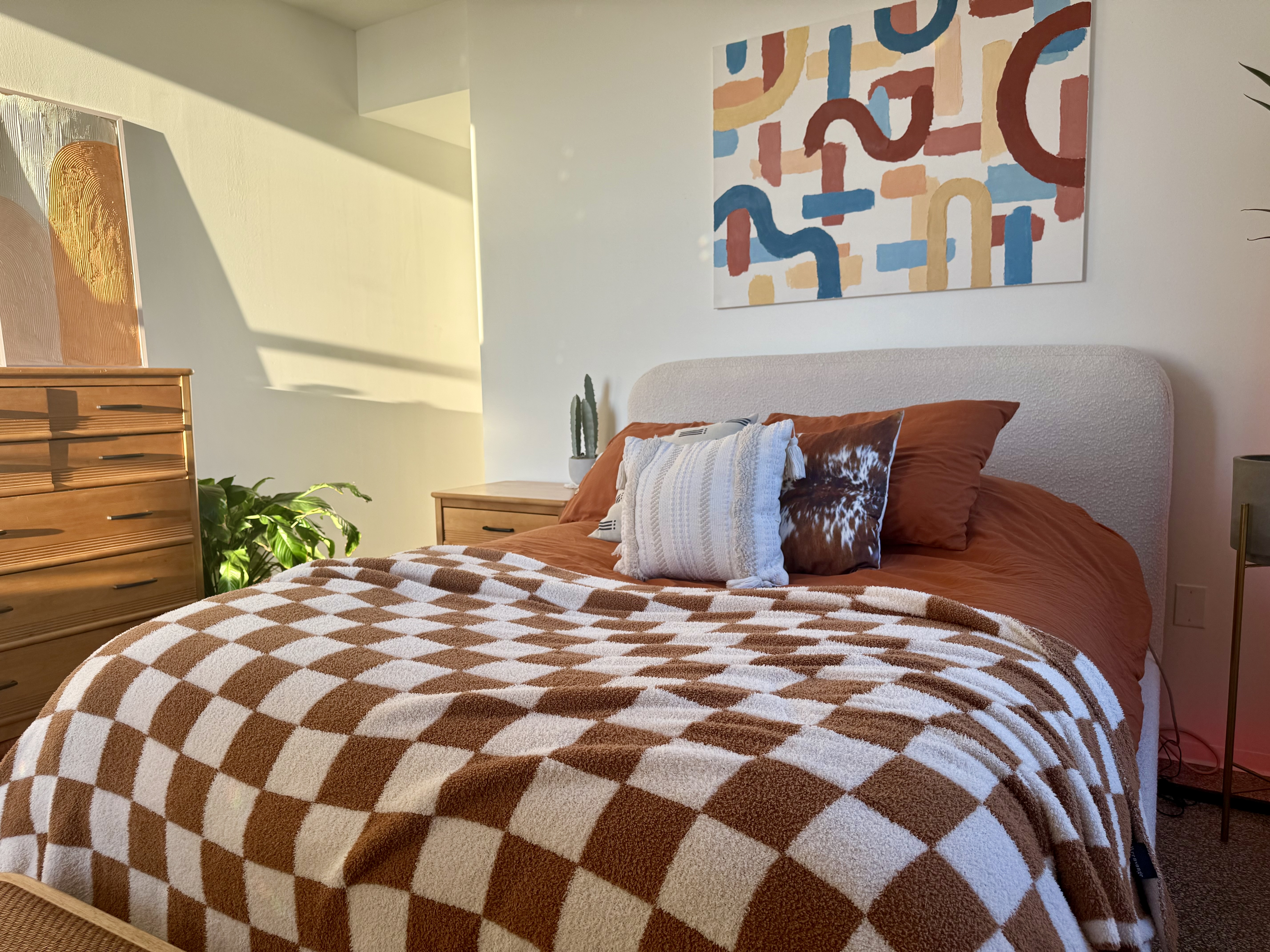 bedroom showcasing dopamine decor through bright colors, eclectic prints, and joyful decor pieces