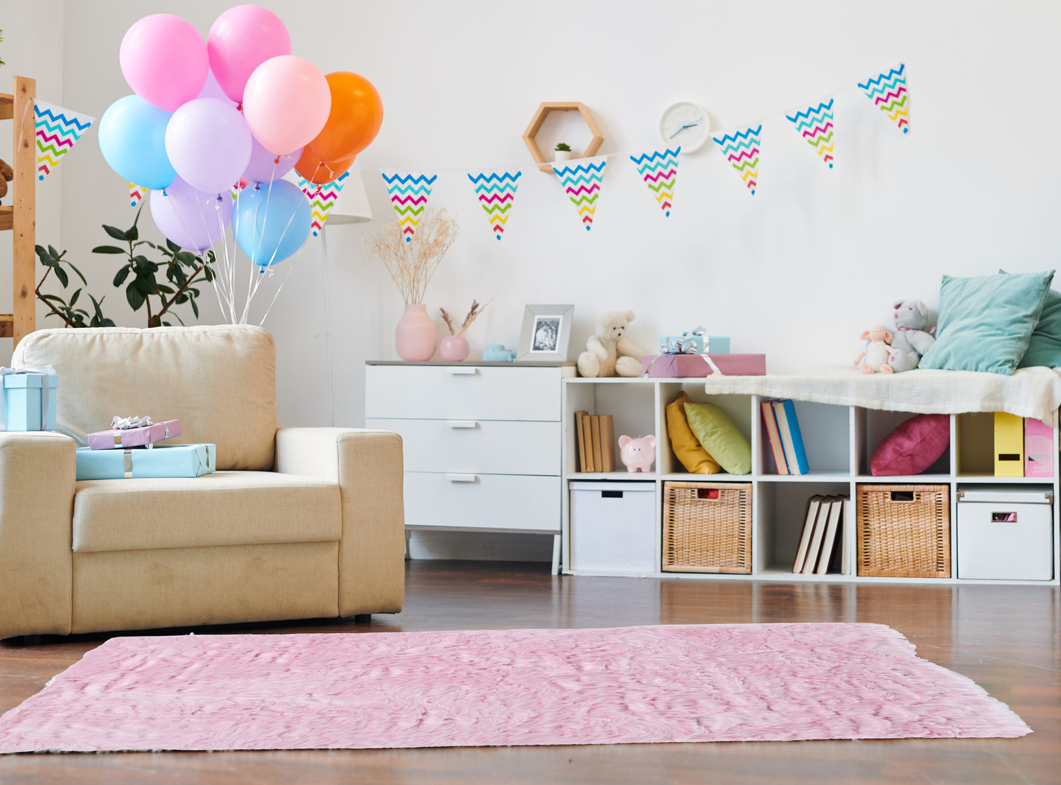 fluffy faux sheepskin pink rug on floor of home surrounded by birthday party decorations