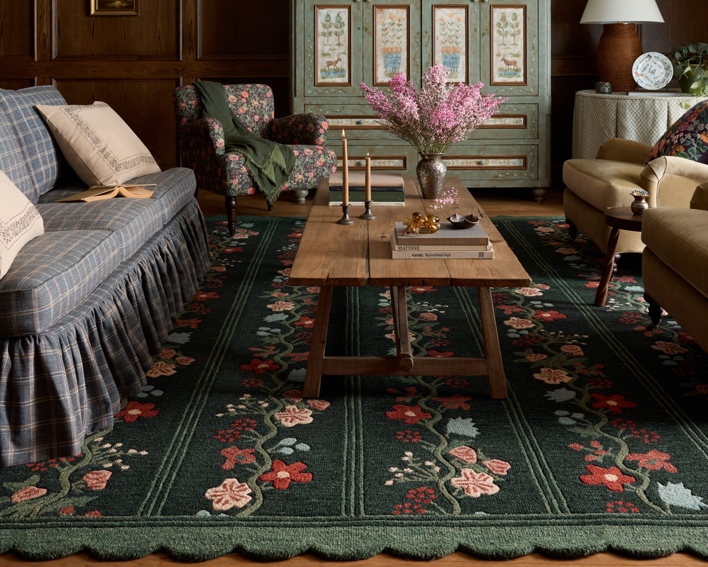 Floral multi-colored rug styled in a traditional vintage living room