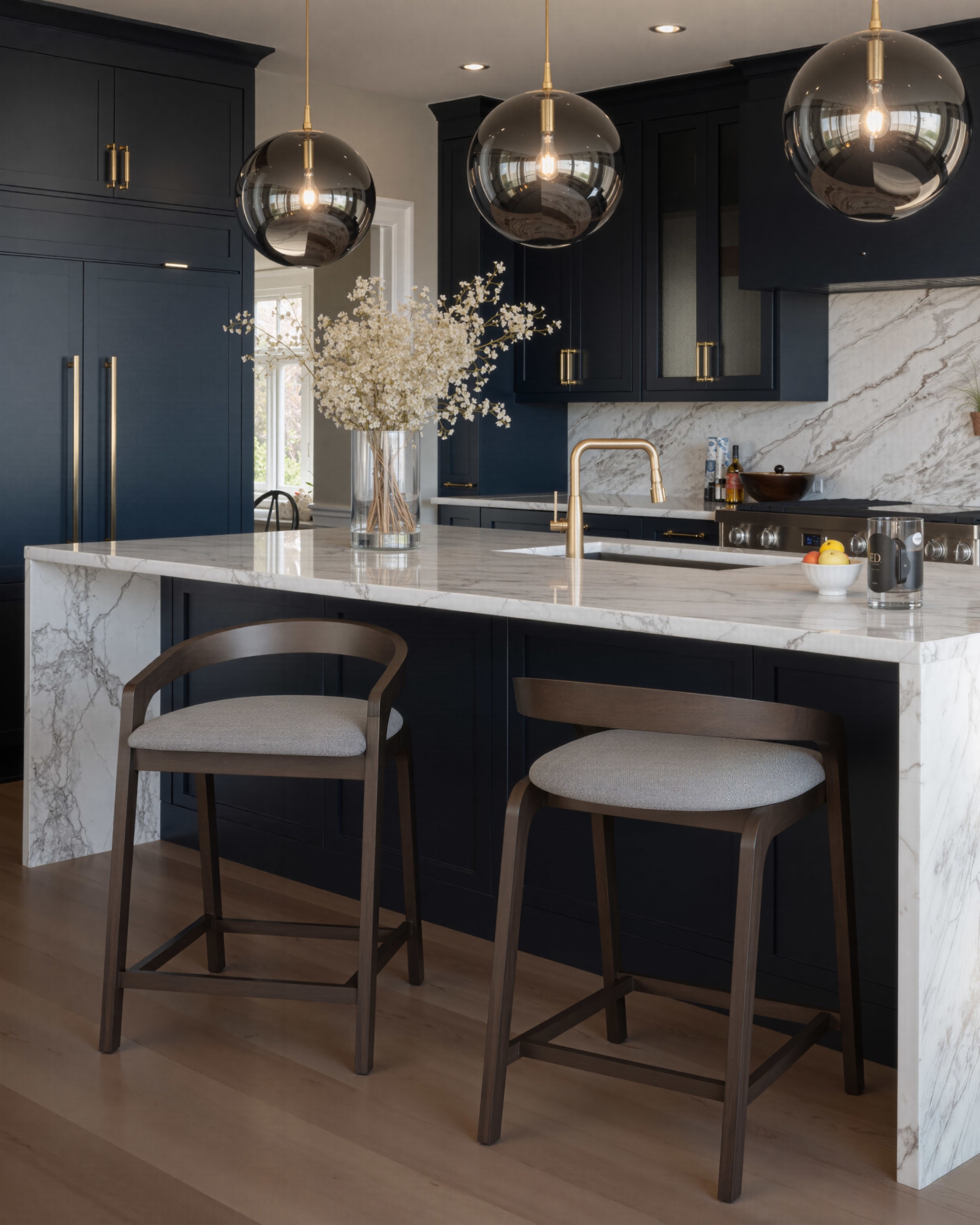 bar stools placed at a modern kitchen island