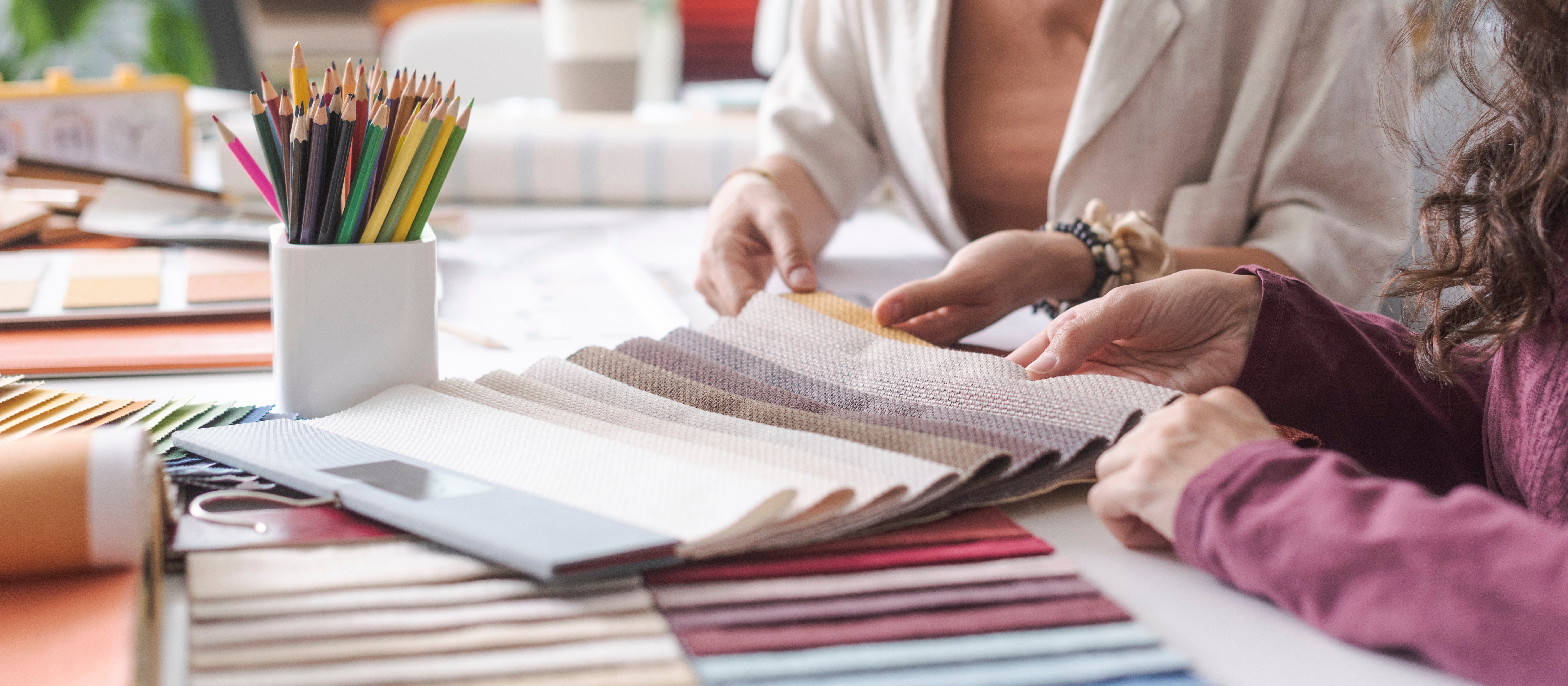 Designer working with client picking out fabric