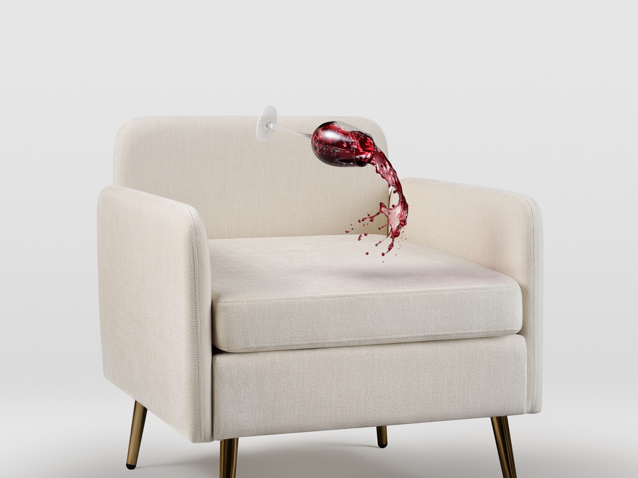 Wine glass spilling on fabric sofa