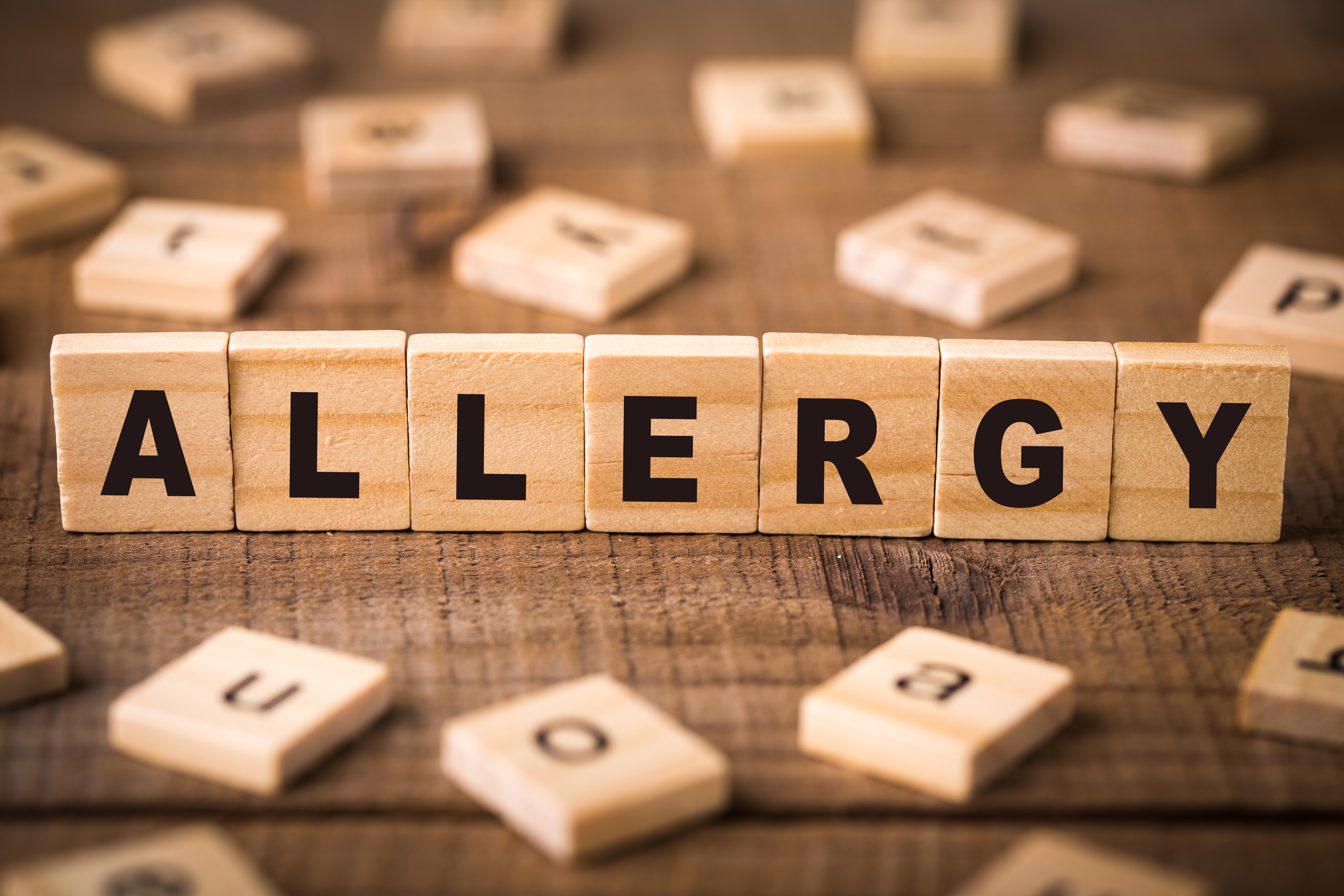 Allergy spelled out on Scrabble Board