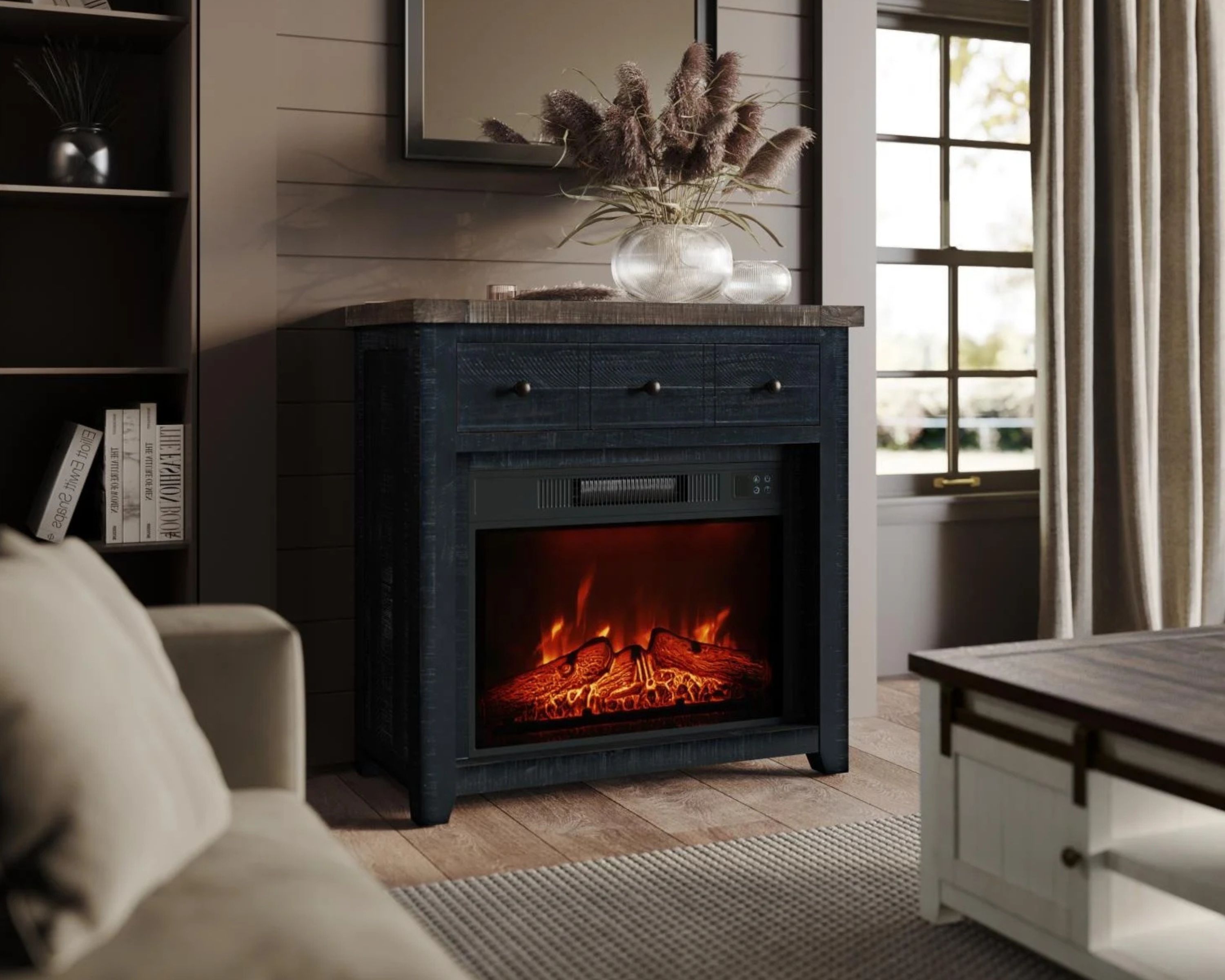 small electric fireplace styled in a fall inspired living room