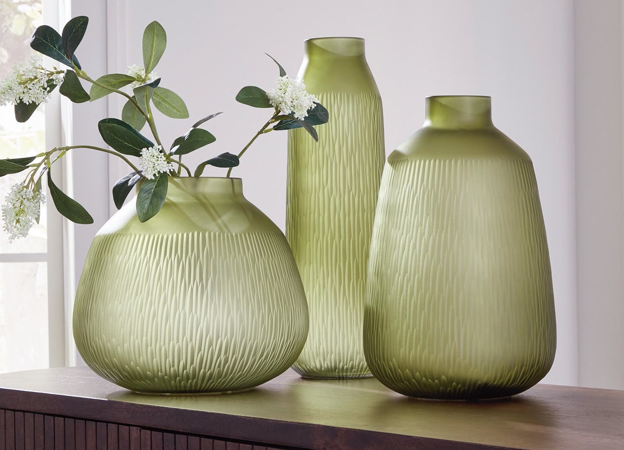 detailed photo of 3 green vases at various heights