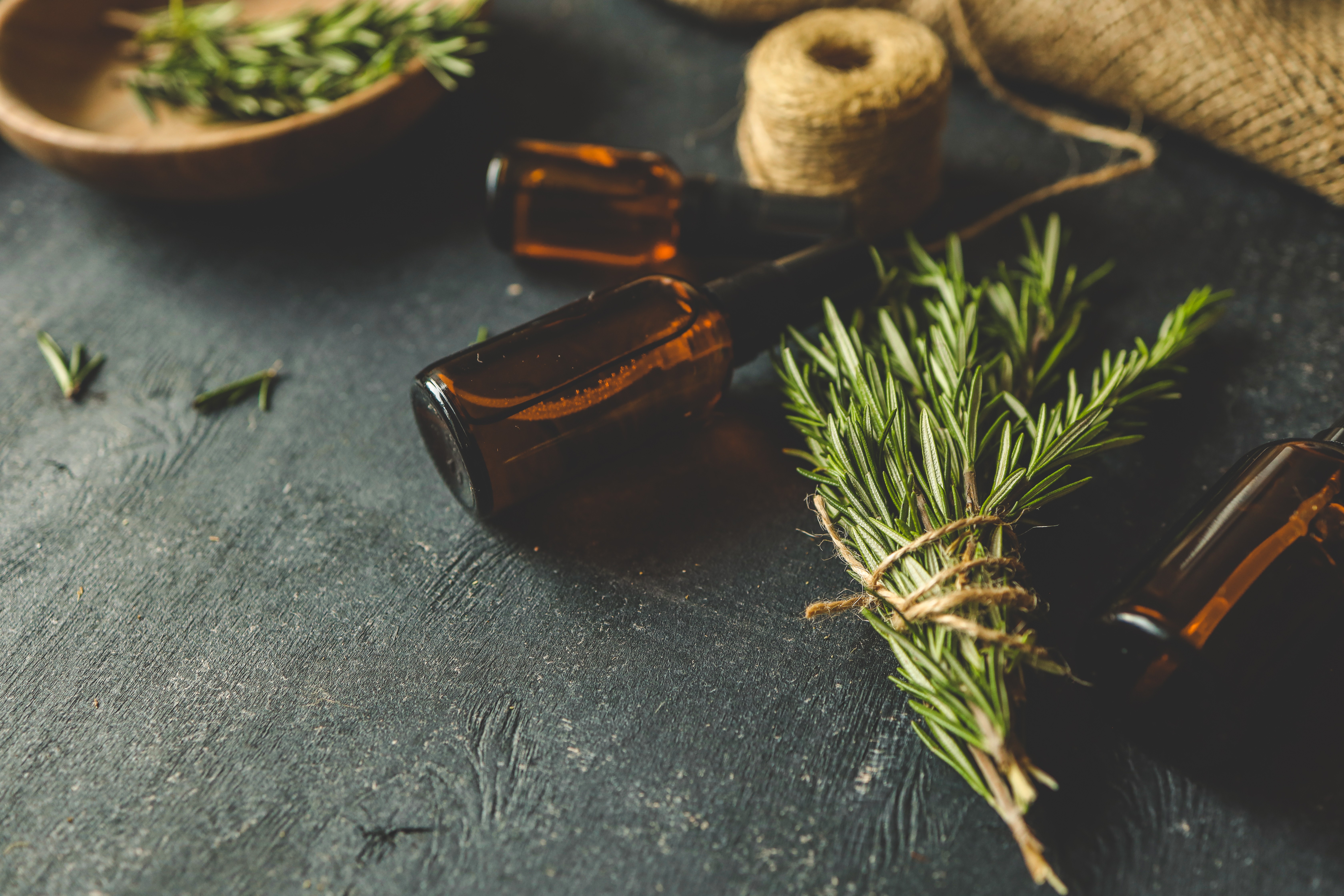 Rosemary and spray bottle of homemade lined spray