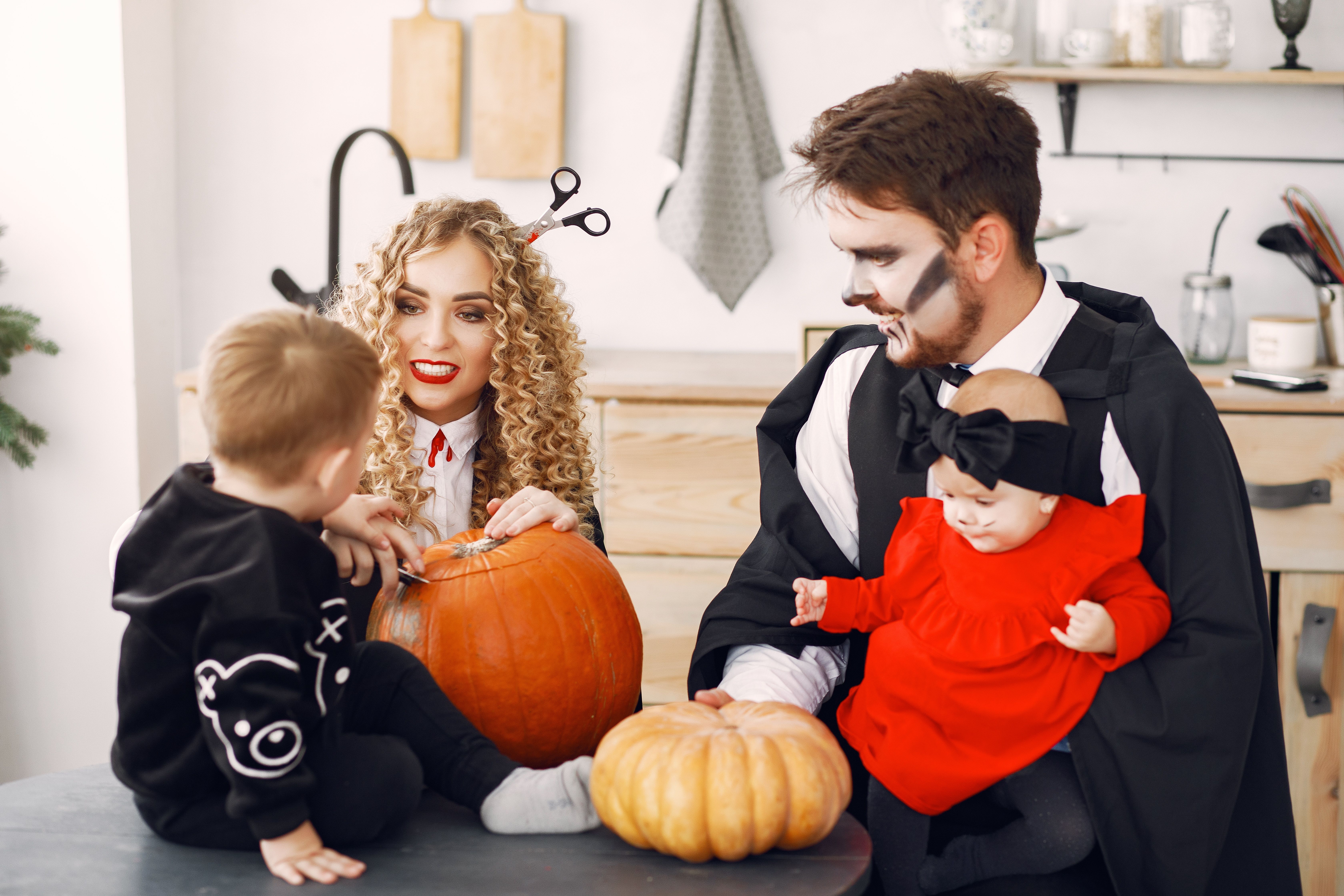 family of four including a baby dressed up for halloween