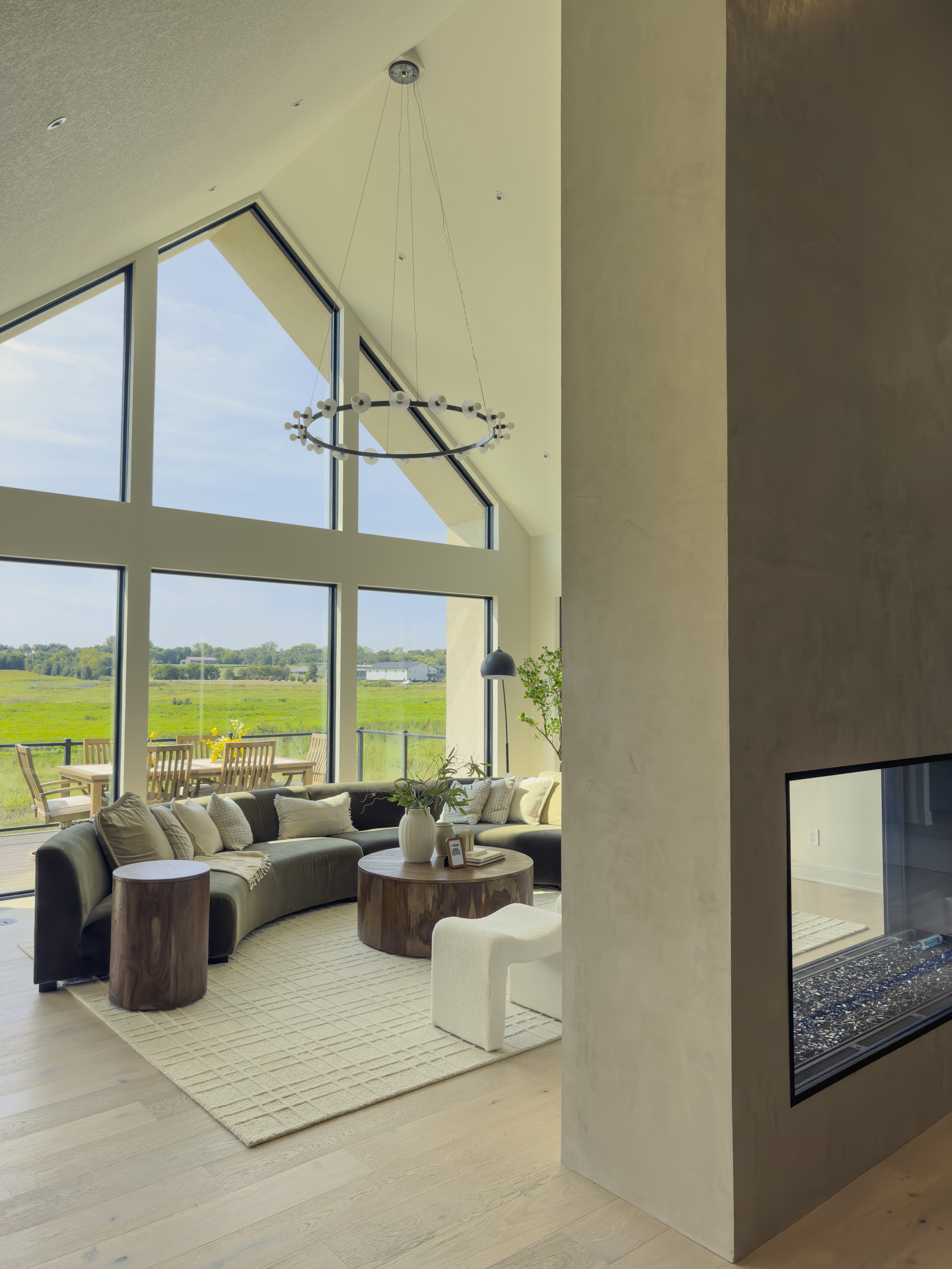 Living room with vaulted ceilings, fireplace but airy feel