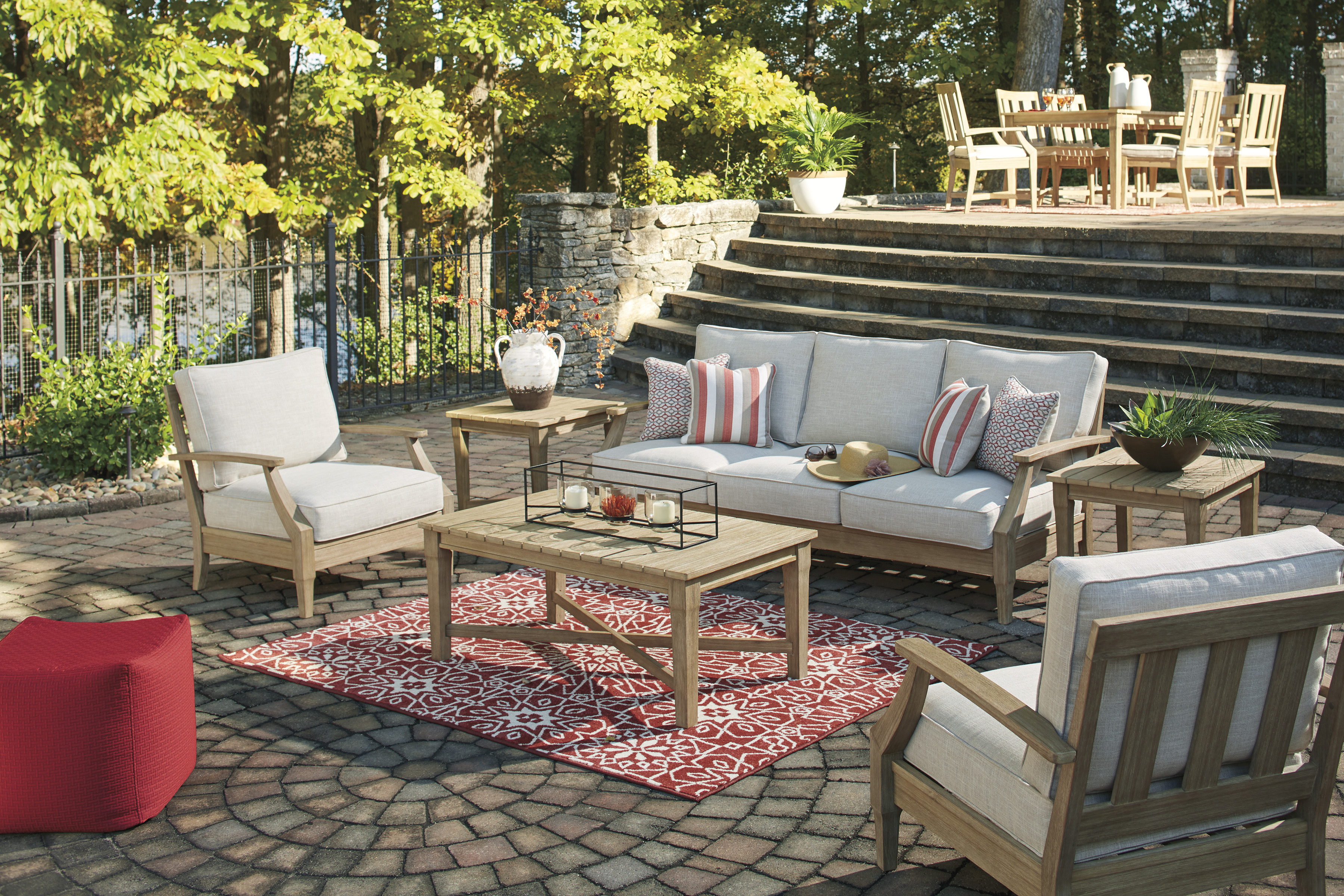 Outdoor pation set with patio dinging set in background