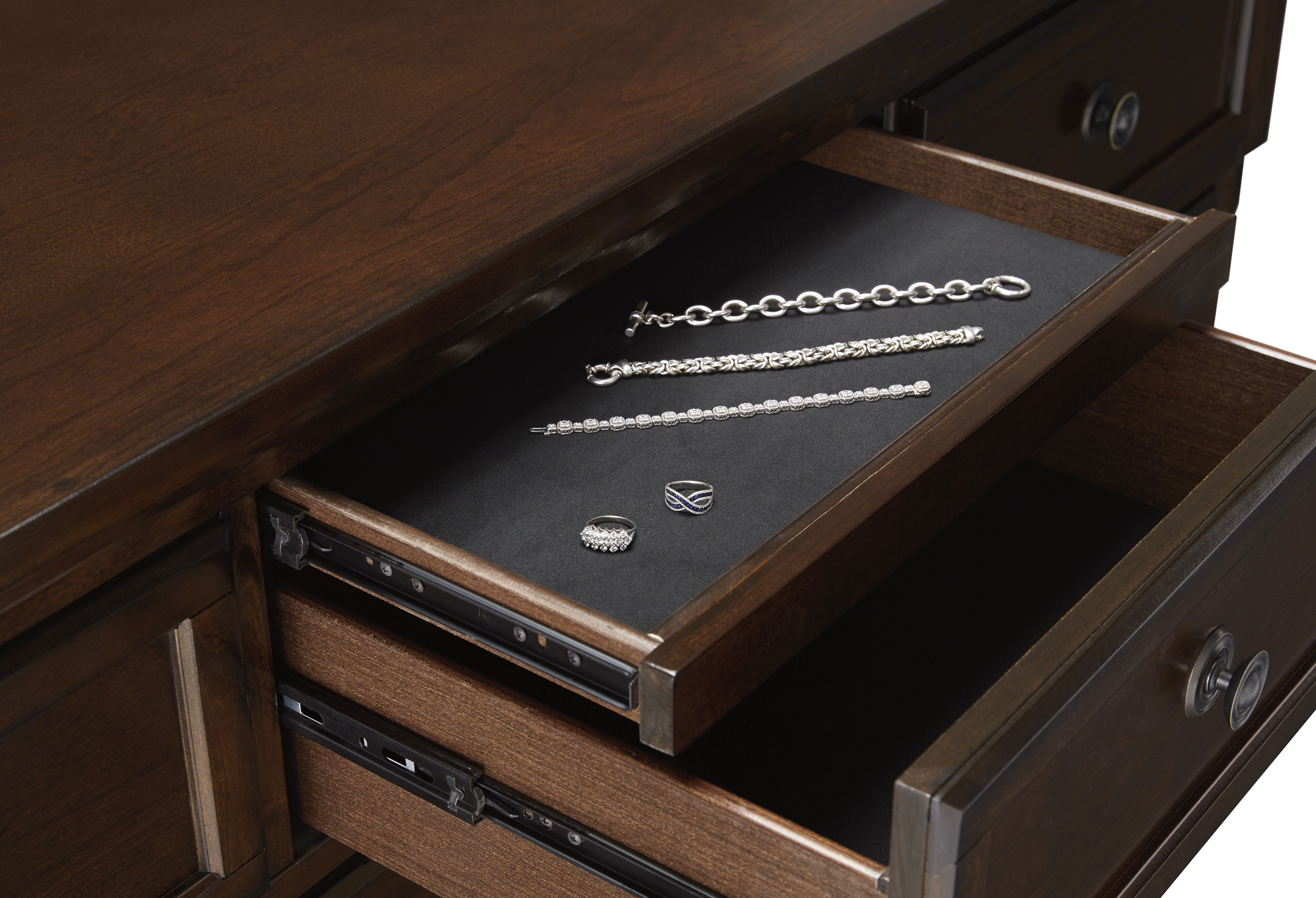 Dark brown dresser drawer with upper concealed drawer
