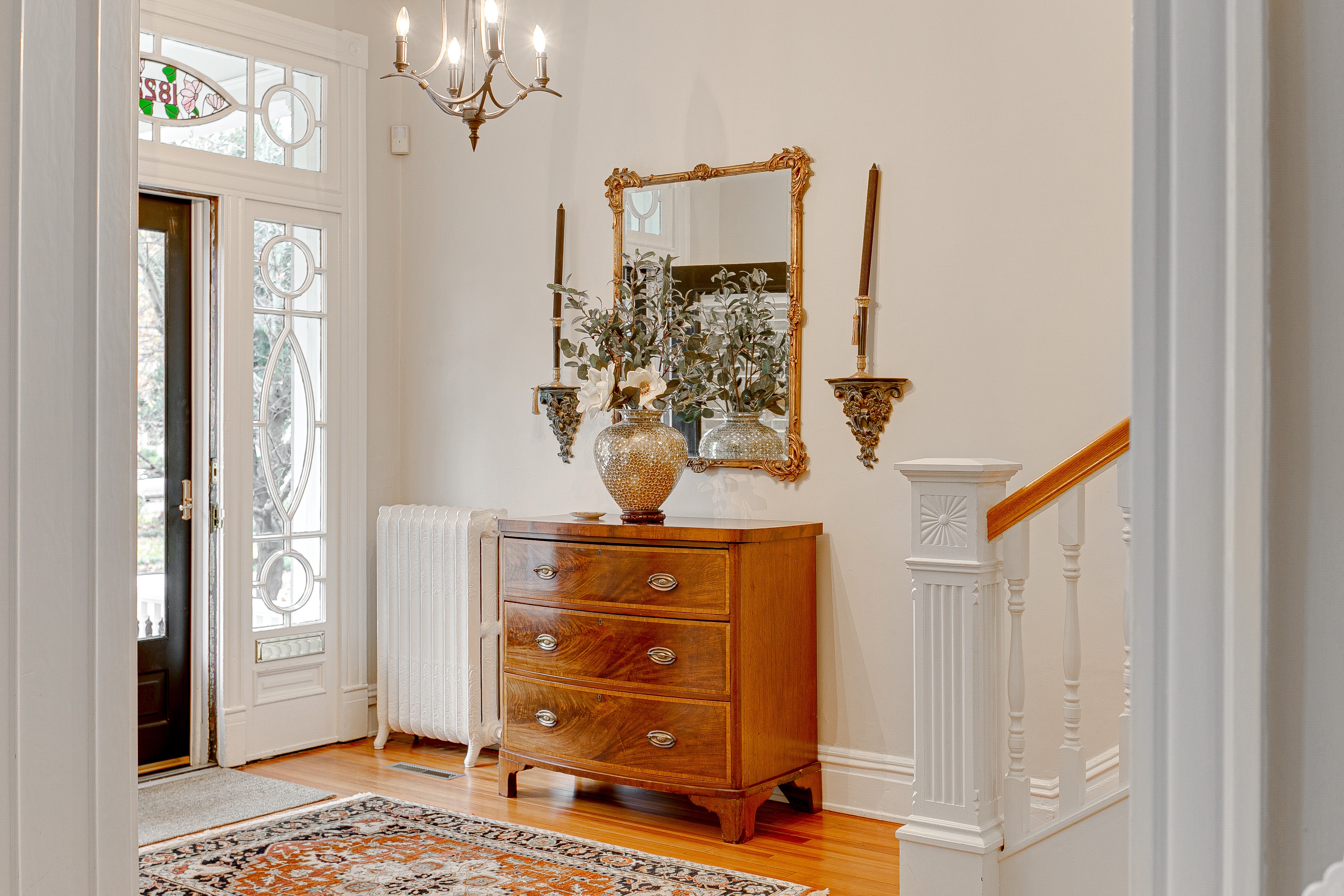 Classic entryway with light, but old-money feel