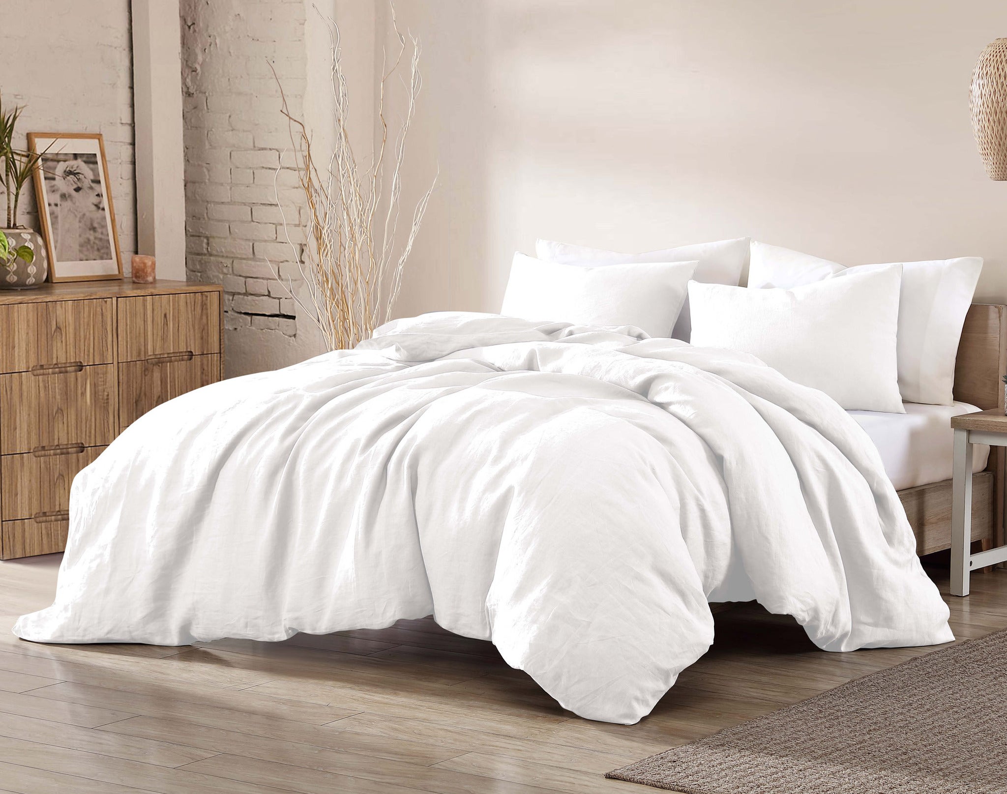 White comforter on bed in a styled bedroom scene