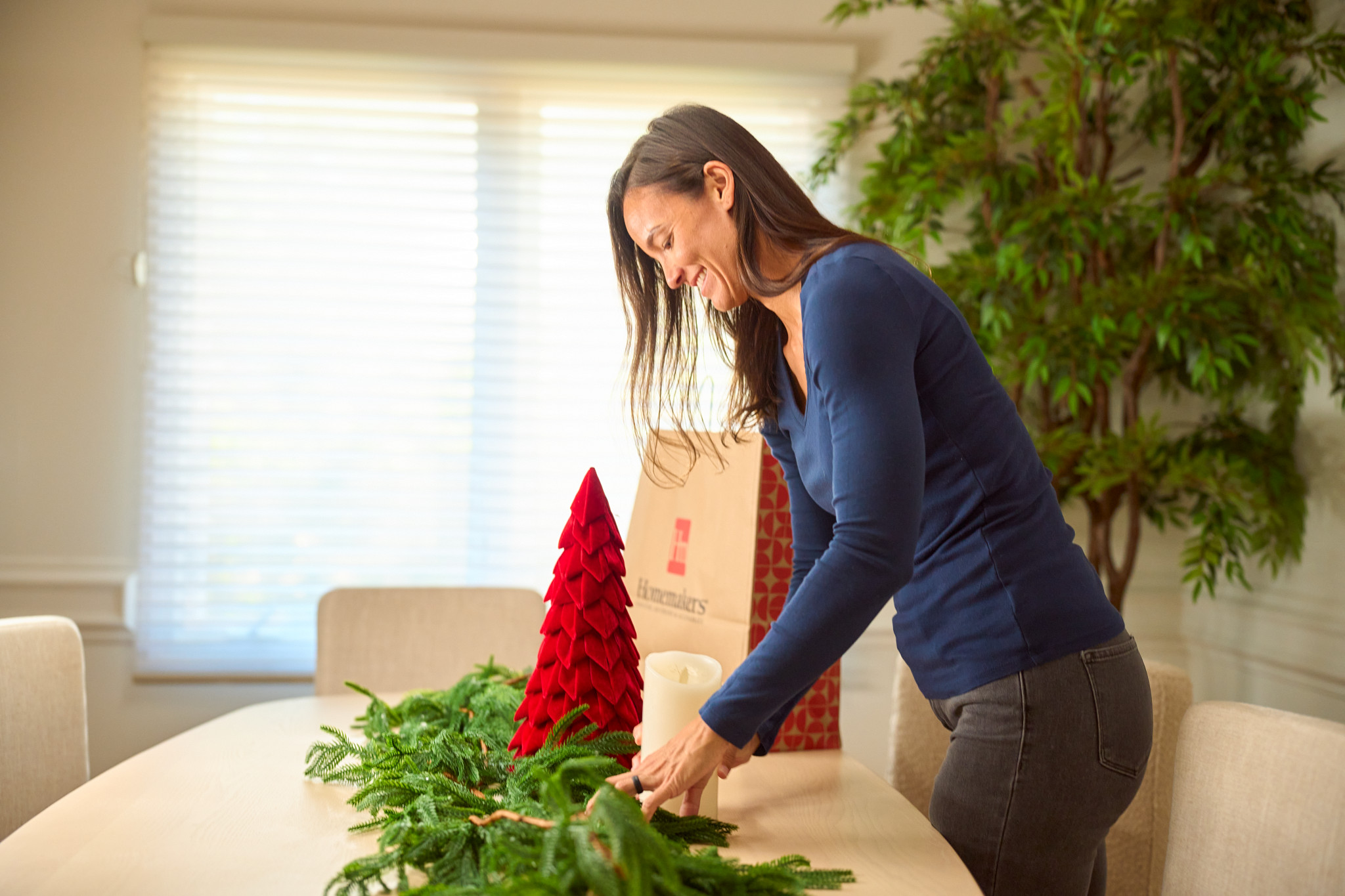 Woman decorating a home for the holidays
