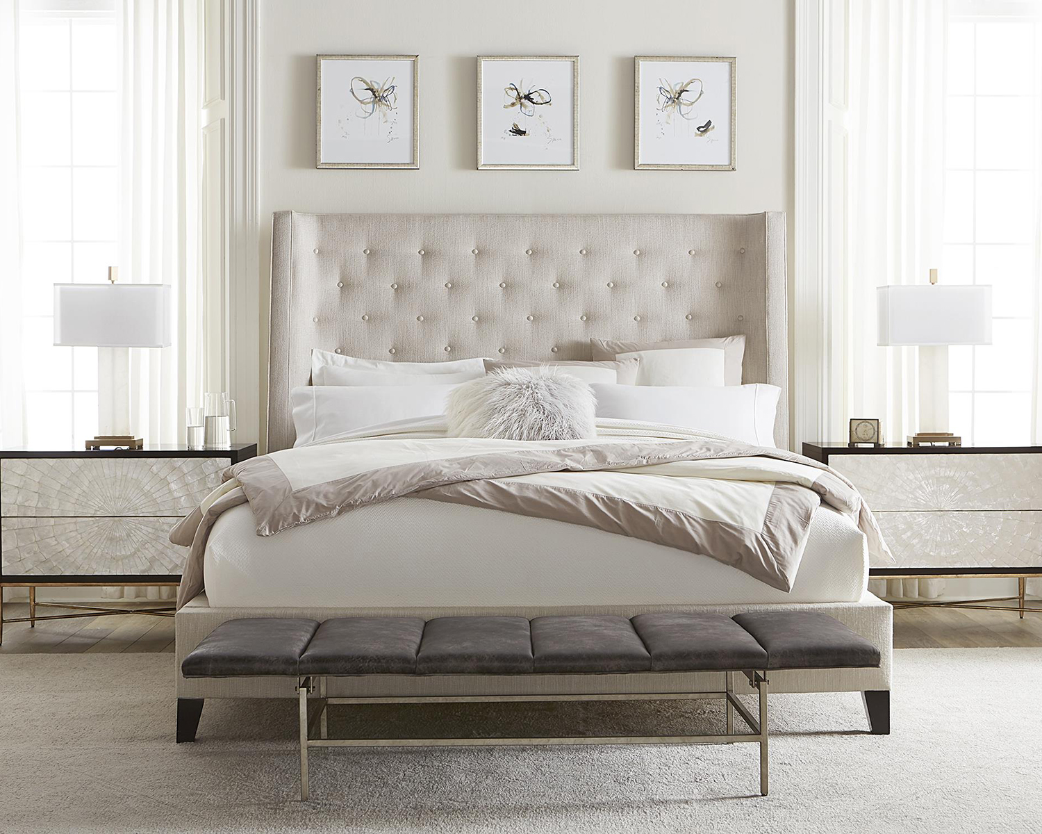 Bernhardt beige button tufted king bed in  a styled bedroom scene