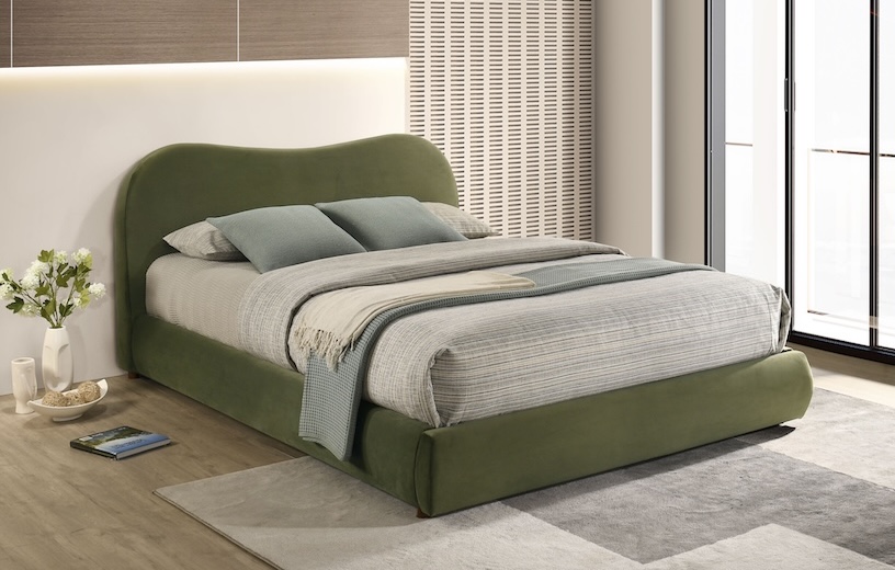 green curved upholstered bed
