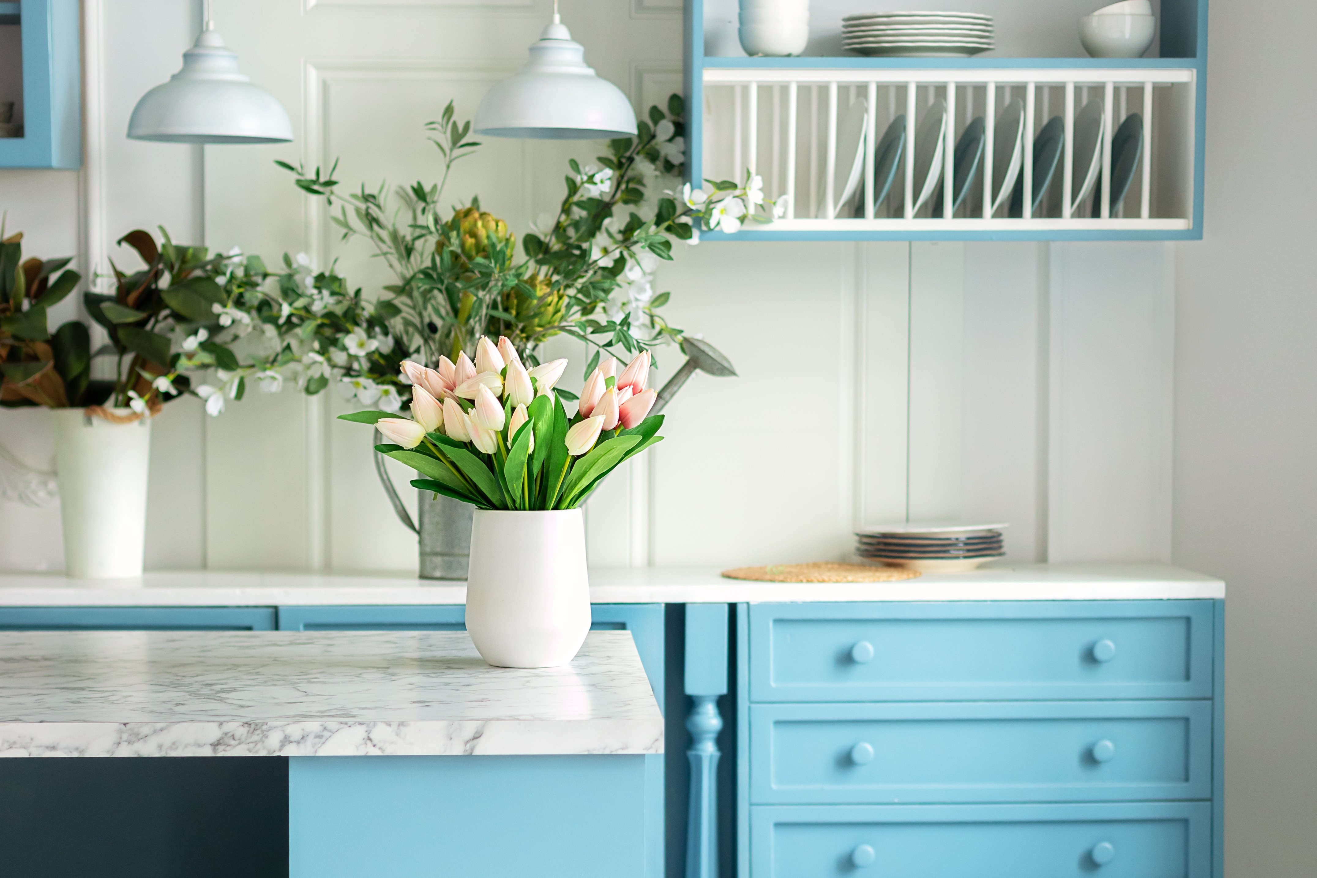 Beachy blue cabinets in light and airy kitchen