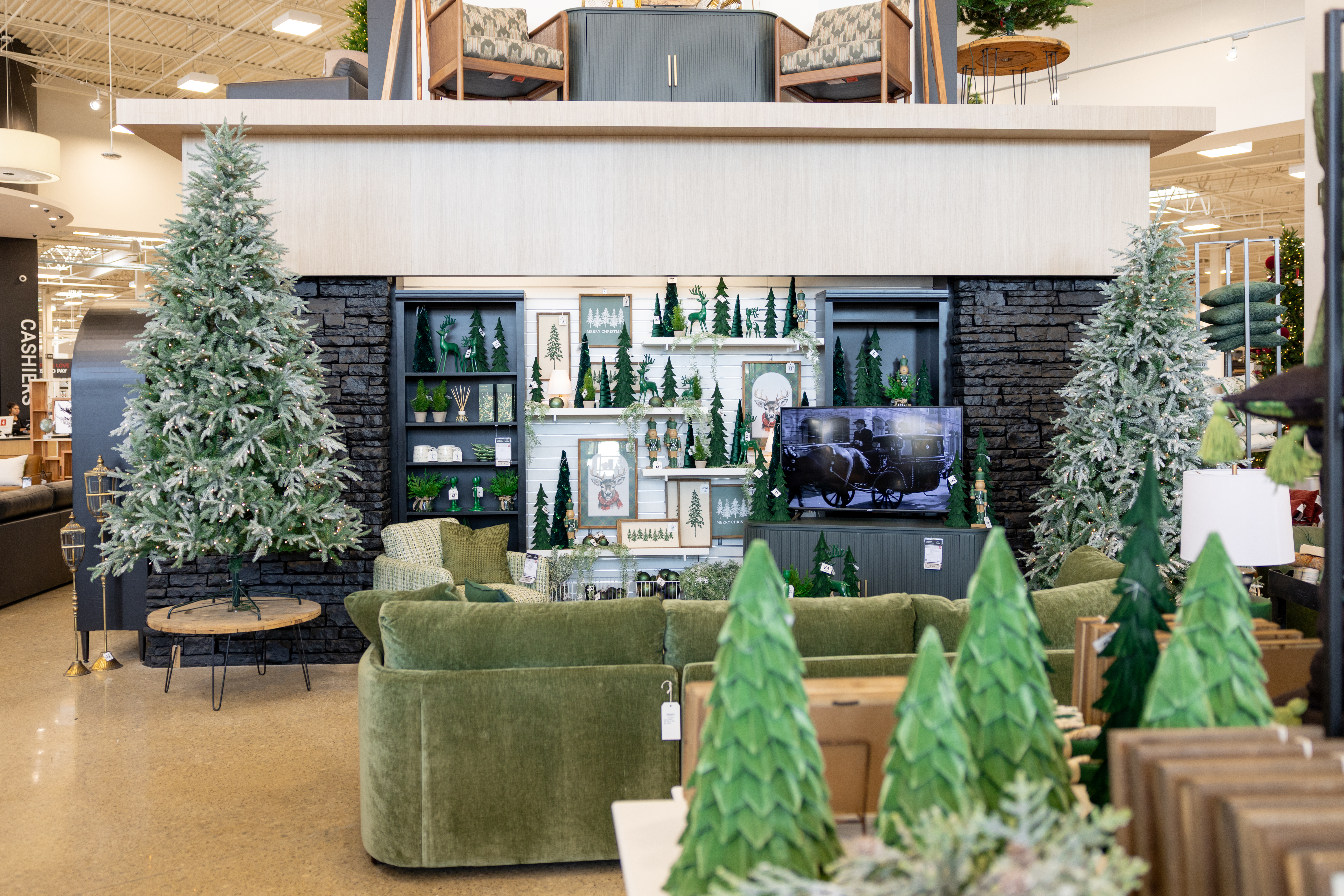 Homemakers Furniture Store holiday display of green furniture and Christmas decor