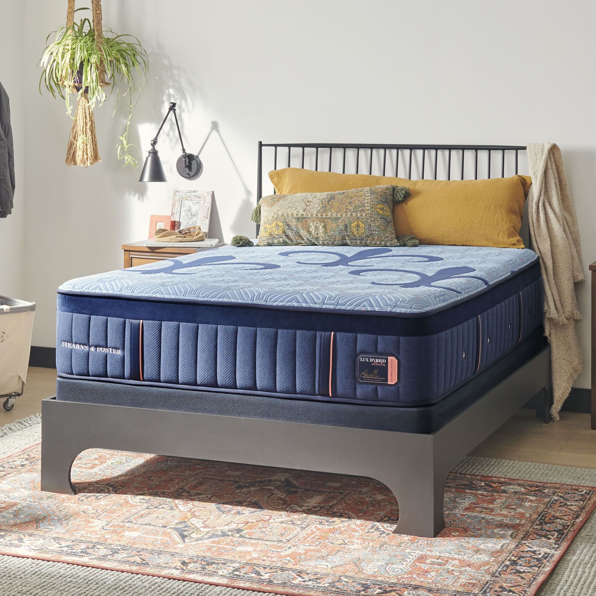 Bedroom nightstand styled beside a bed