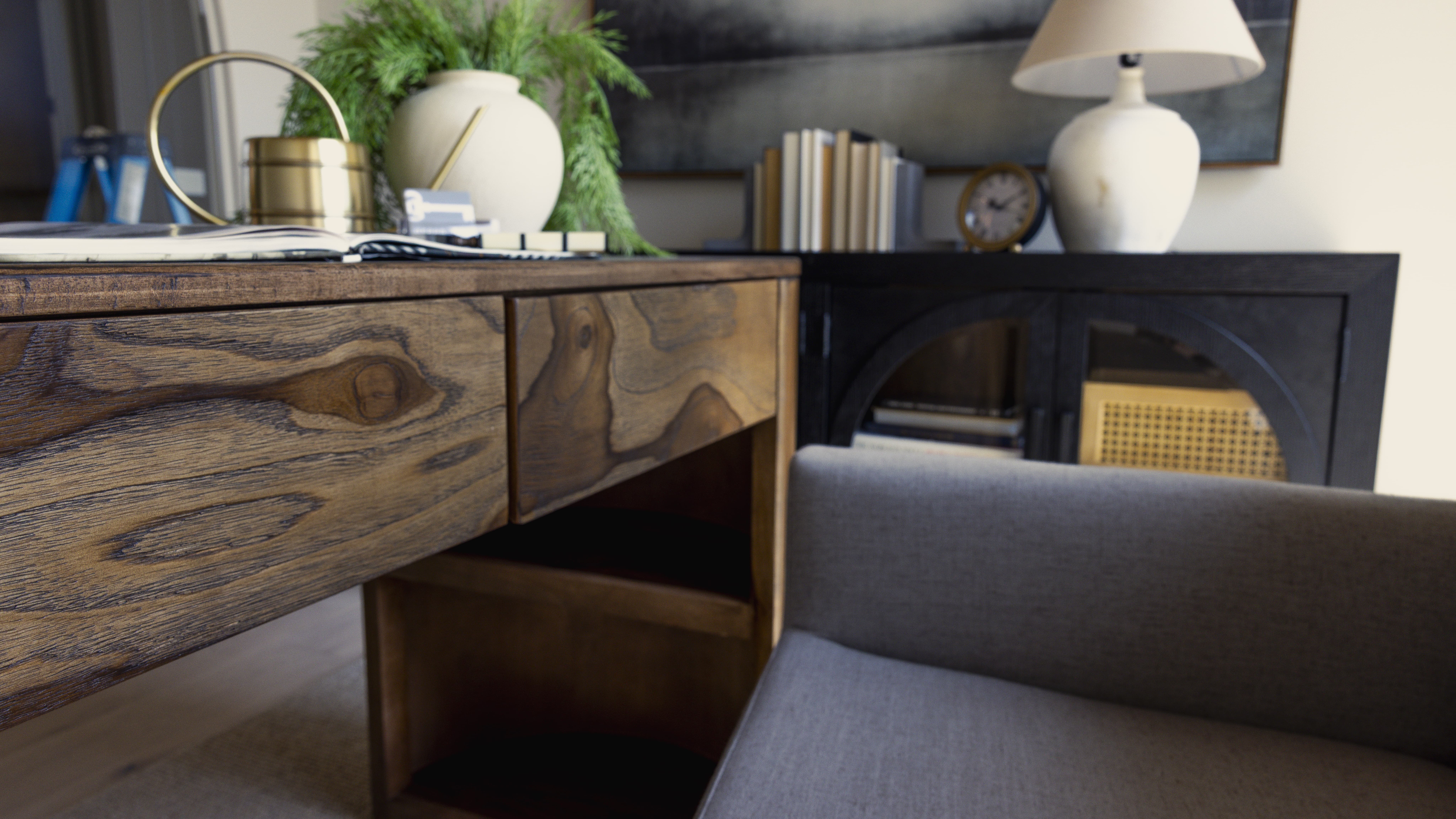Office with natural wood desk and earth toned accessories